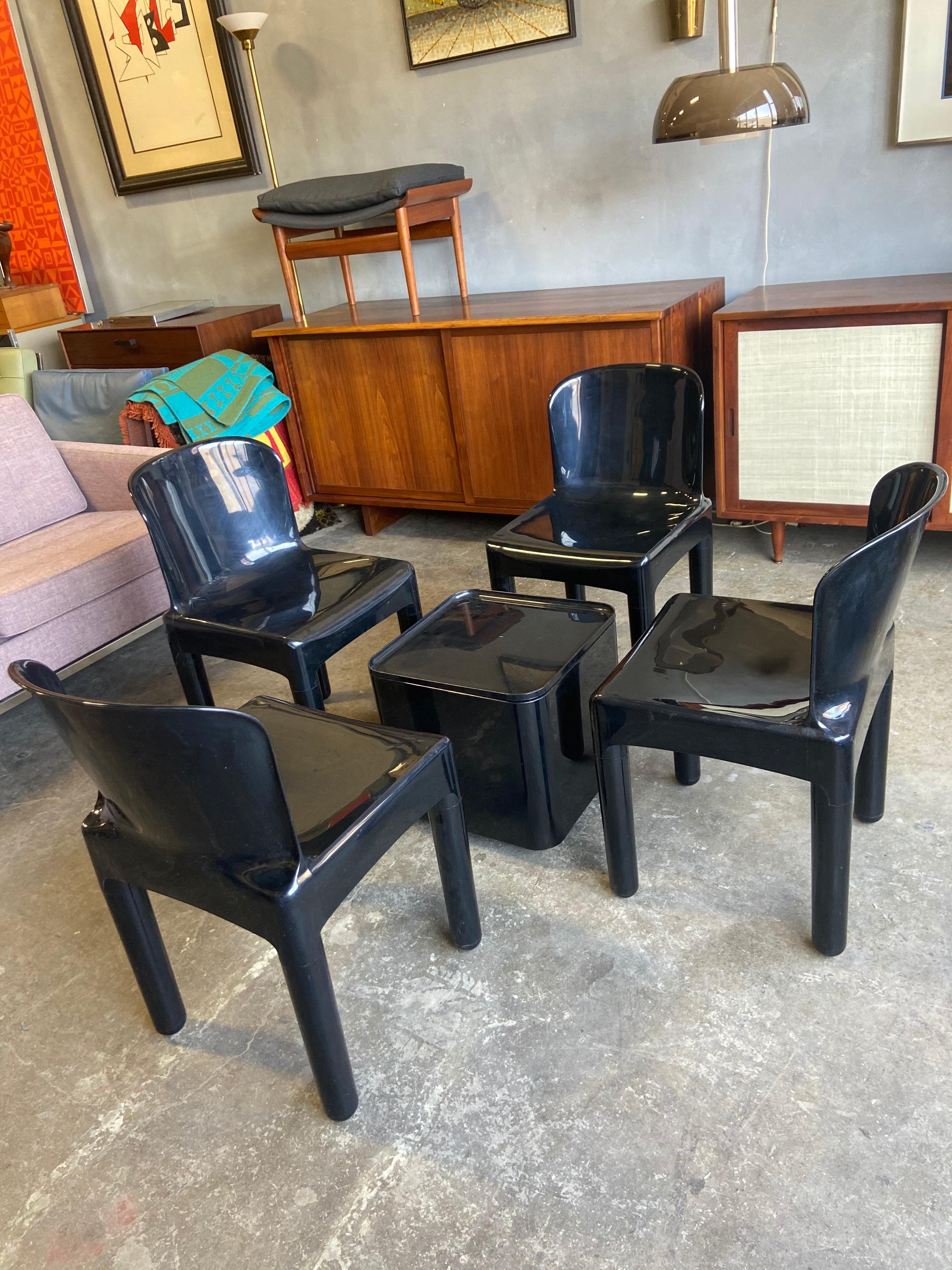 For your consideration are these fabulous and rare set of four black molded plastic dining chairs and table by Marcello Siard. Featuring a sturdy and classic Italian Modern Space age look that Siard, Joe Colombo, Kartell, Giancarlo Pieretti,