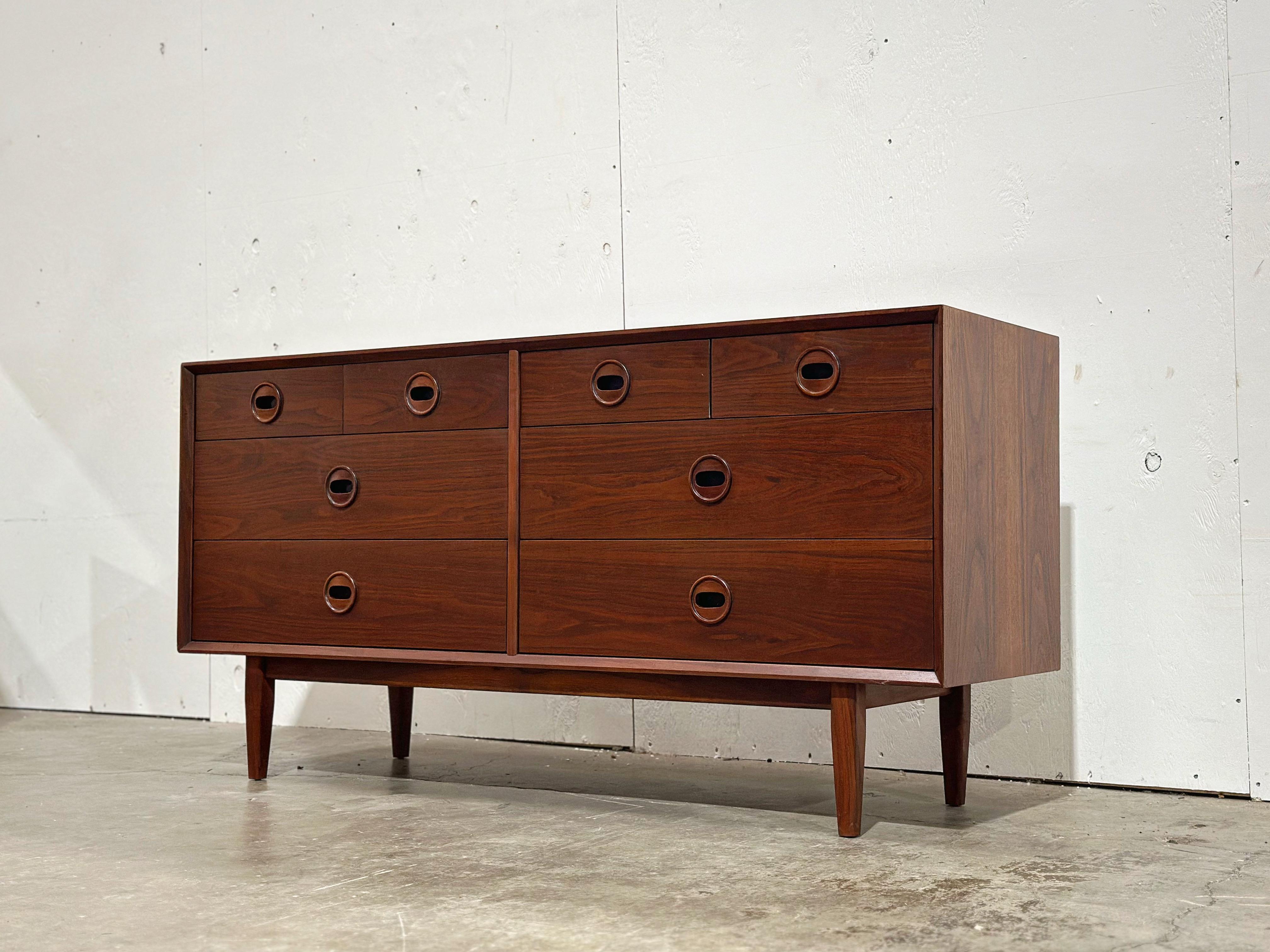 Vintage mid century modern eight drawer dresser in black walnut by Jack Cartwright for his 
