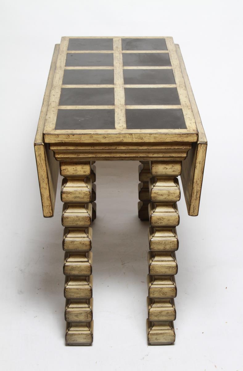 Midcentury drop-leaf table in a Jacobean-influenced style with a polished slate inlay top and stacked cubic legs. The piece is in good vintage condition with some age-appropriate wear to the bottom of the legs.