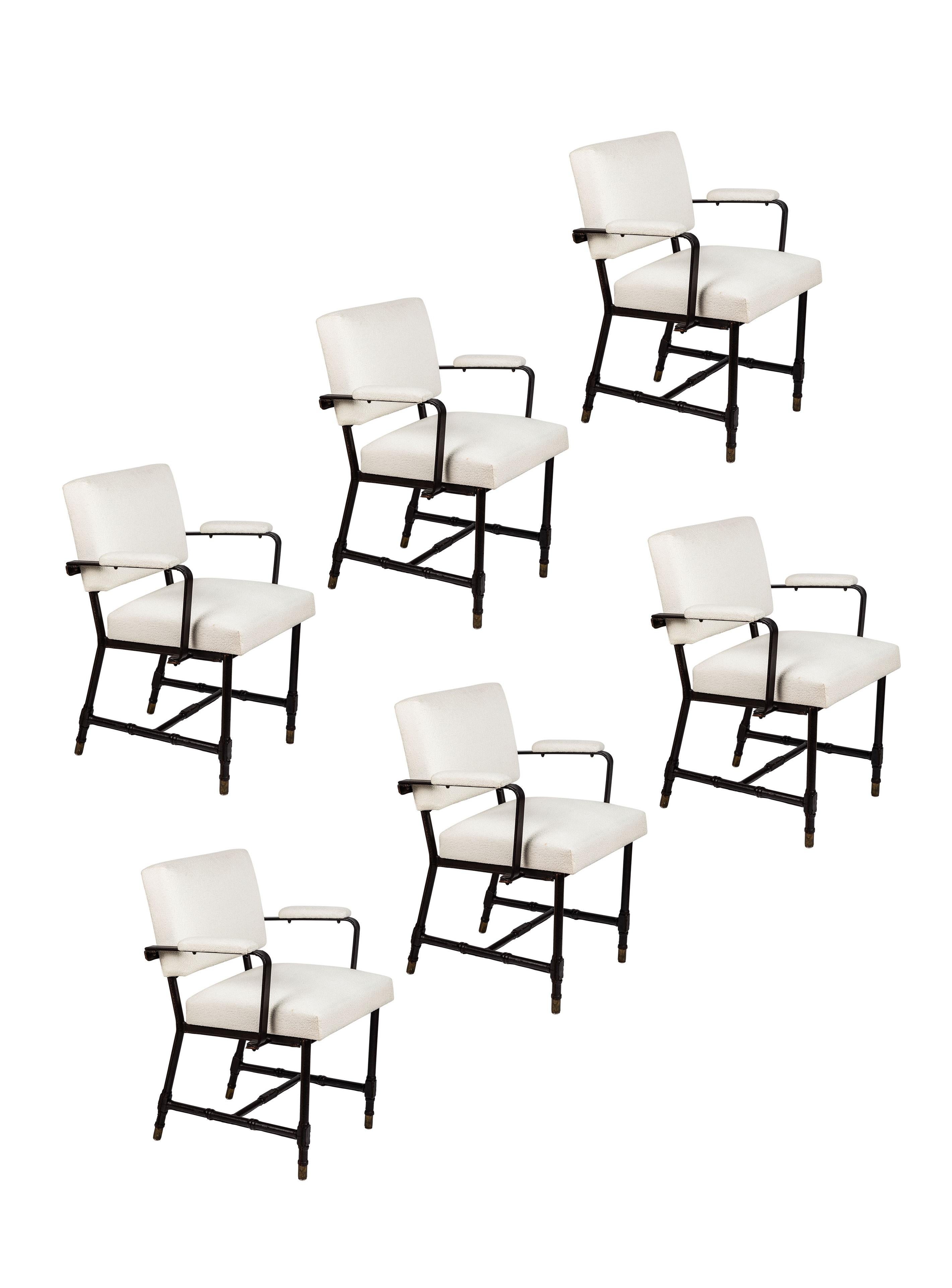 An exceptional set of six (6) armchairs by Jacques Adnet. 

Featuring his signature hand stitched leatherette base with brass sabots, newly upholstered seats, backs and arms in white bouclé, French, 1950s.

Provenance: Michel Contessa, Miami.