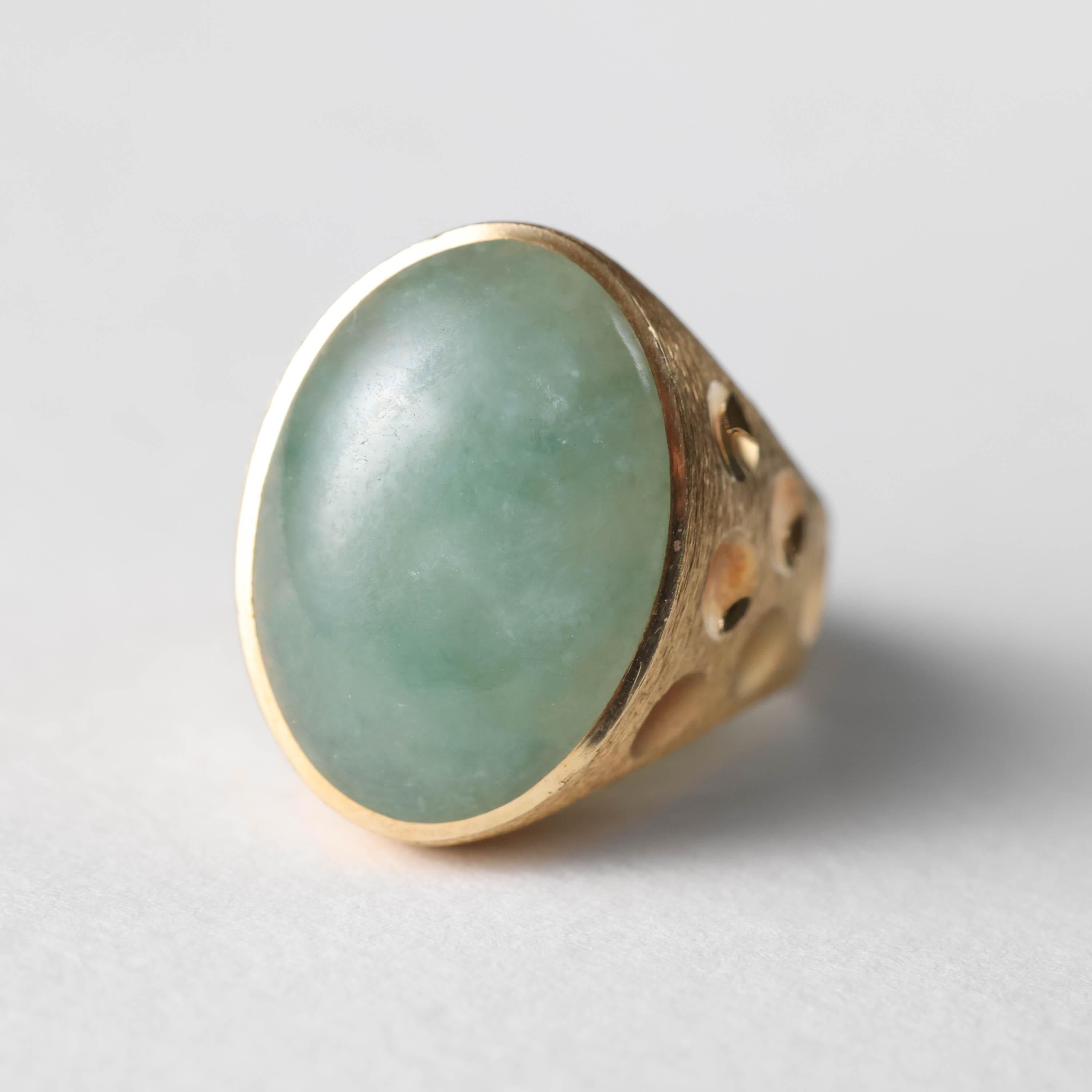 This is one substantial -and substantially cool- jadeite jade ring from the middle of the last century (circa 1960s). This Mod and modern, natural and untreated Burmese jadeite ring is incredibly impressive and the very definition of