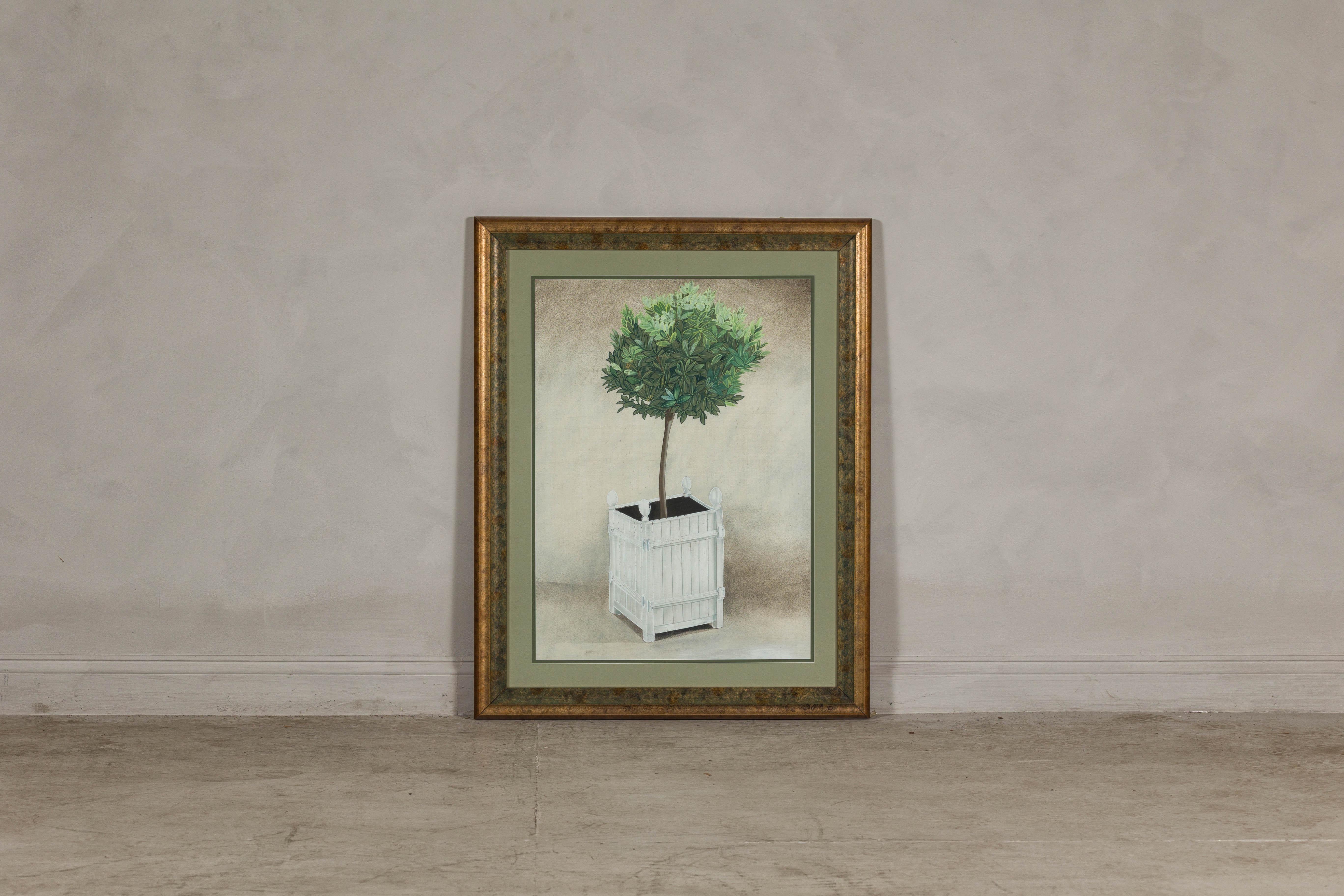 This midcentury Japanese botanical print, presented in a custom gold leaf frame, effortlessly blends the timeless charm of traditional Japanese art with a refined contemporary aesthetic. The focal subject—a meticulously detailed topiary tree set in