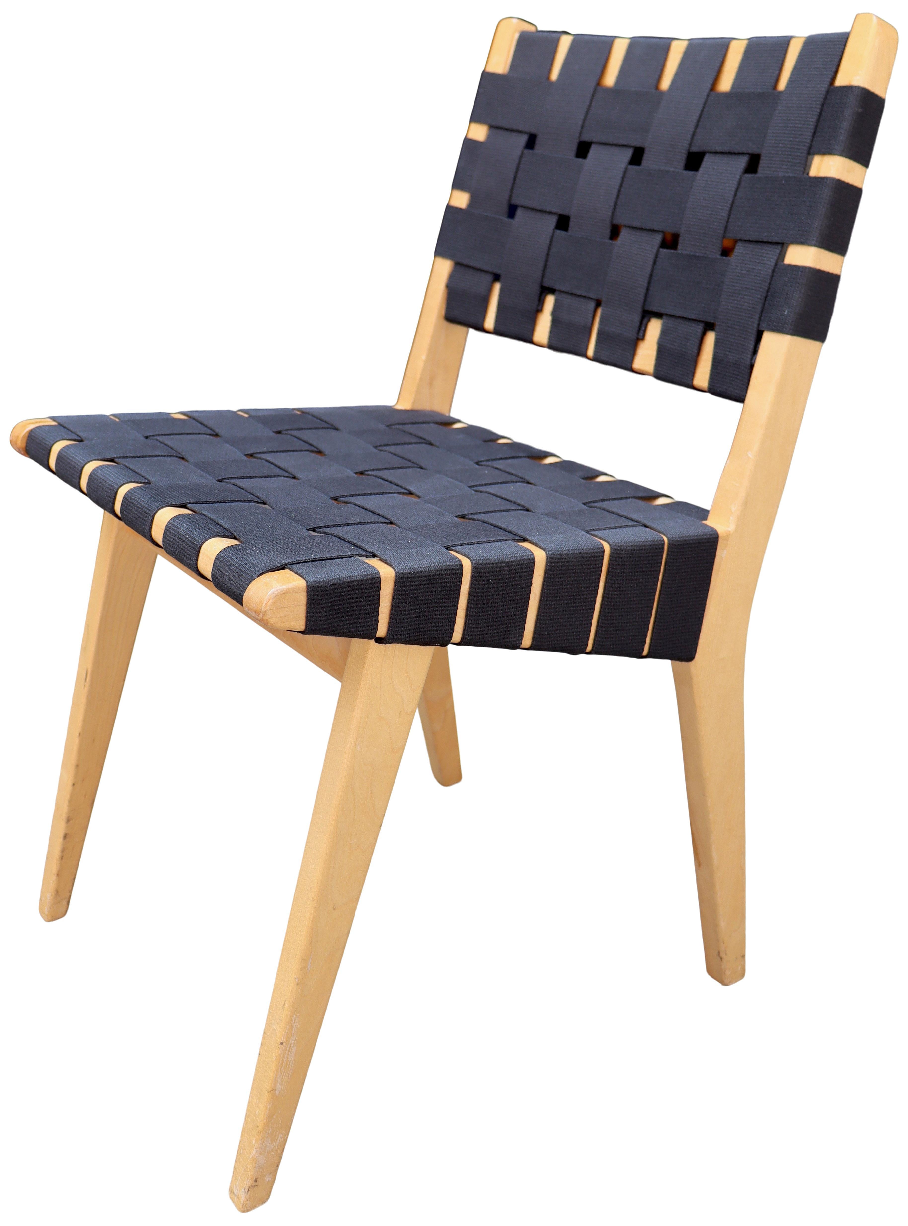 Simple classic and honest design made this side or dining chair so popular that its still in production today. Made from solid maple wood and black cotton strapping. A classic midcentury design that was first designed in 1942 was one of Knolls first
