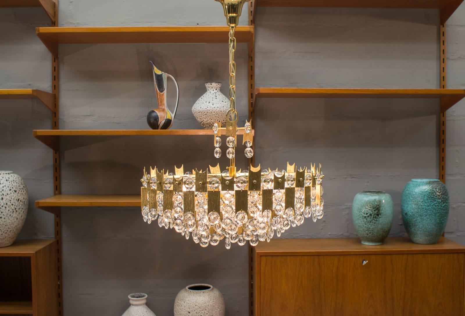 Fabulous 1960s 24-karat gold-plated and crystal glass chandelier by Palwa (Palme & Walter) of Germany. 
 This is a statement piece that explodes prism light when lit.
     