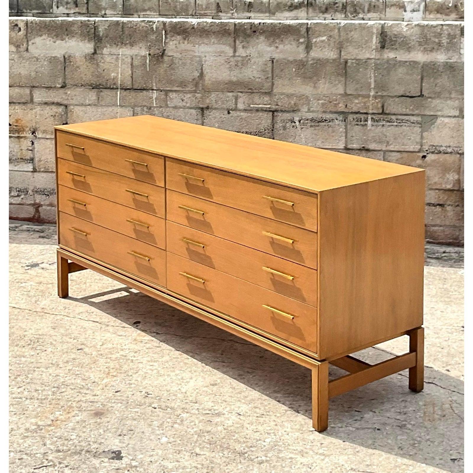 Fantastic midcentury 8 drawer dresser. Made by the iconic Johnson Brothers in the US. They were the makers of some of the most prestigious MCM designers collections in history. Beautiful mole cabinet with chic brass trim and hardware. Acquired from
