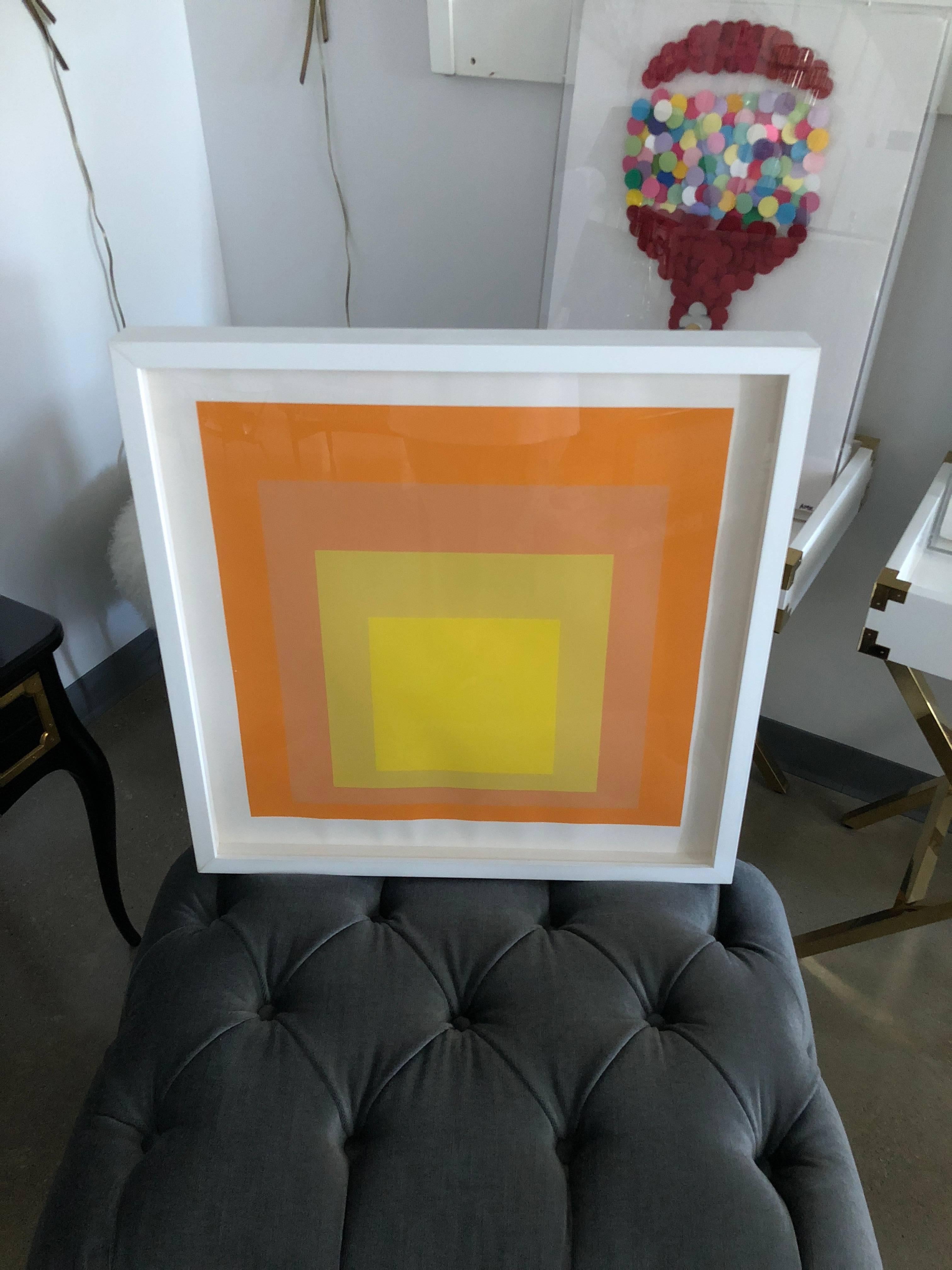 Offered is a framed in white Mid-Century Modern abstract silkscreen by Josef Albers (1888-1976) entitled 