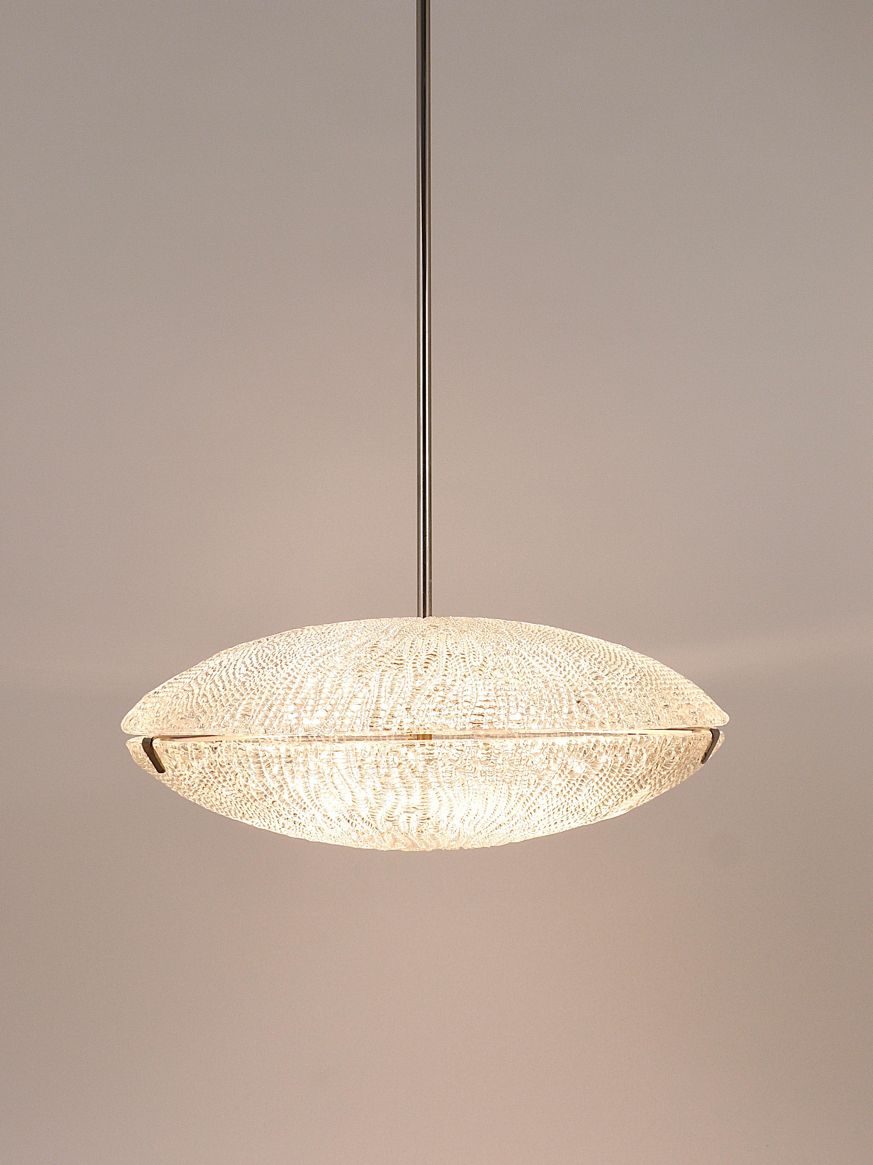 A minimalistic midcentury Discus chandelier from the 1950s. Manufactured by J.T. Kalmar, Vienna, Austria. This beautiful chandelier consists of two large textured melting ice glass discs / bowls (diameter 19 1/2“) on a nickel-plated brass hardware.