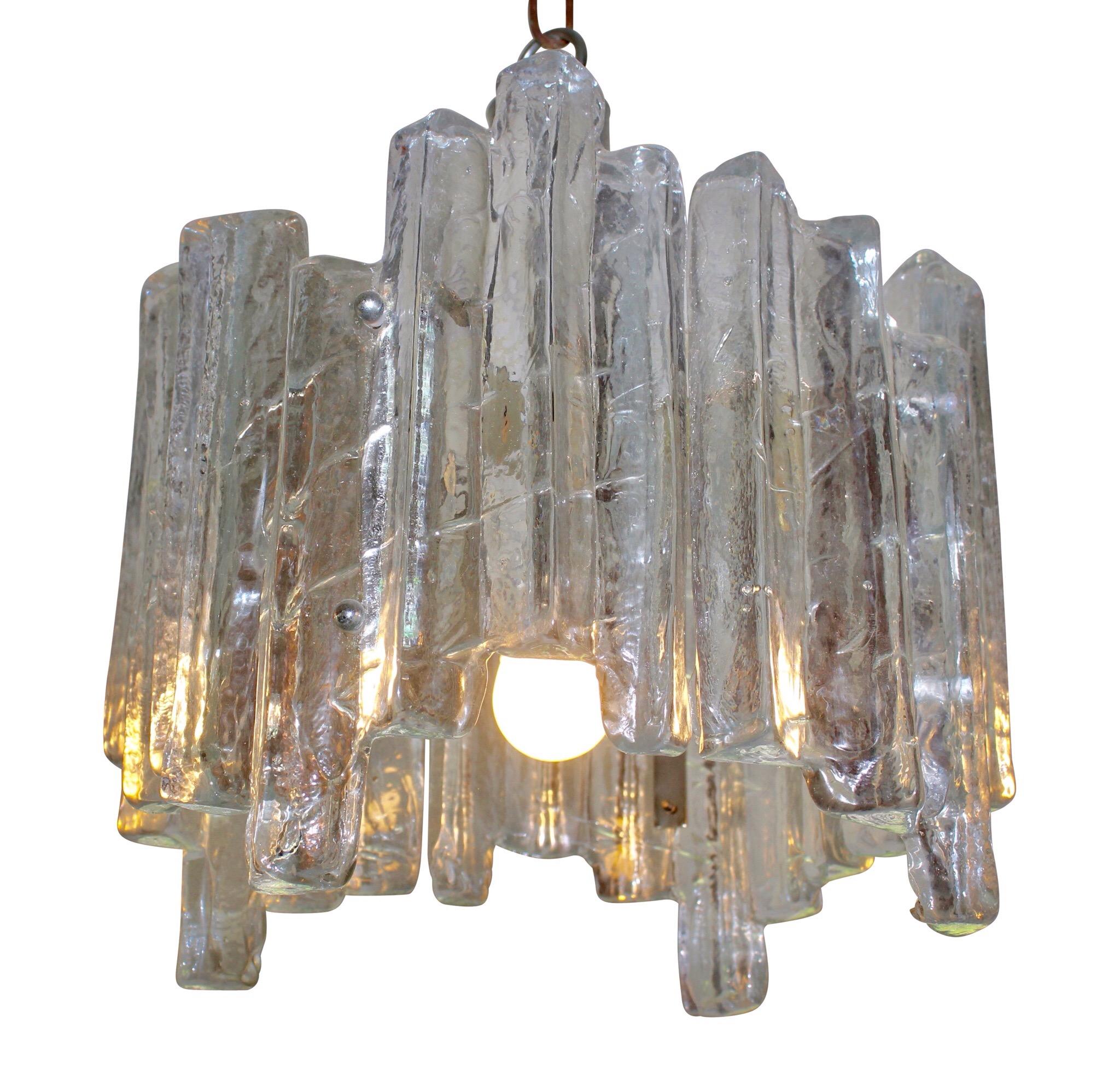 Large chandelier and heavy chrome construction E27 sockets crystal ice glass elements form the 1960s.
And 2 wall mount lamps E14 sockets crystal ice glass elements.
This is a perfectly matching pair.
The difference in color is due to the light