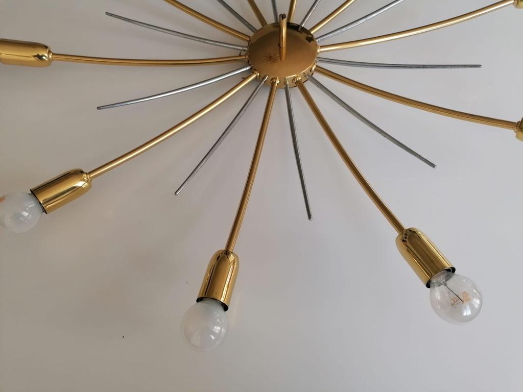 Brass chandelier with 12 arms fitted each with E27 sockets. Manufactured by Kalmar in Vienna in the late 1950s.