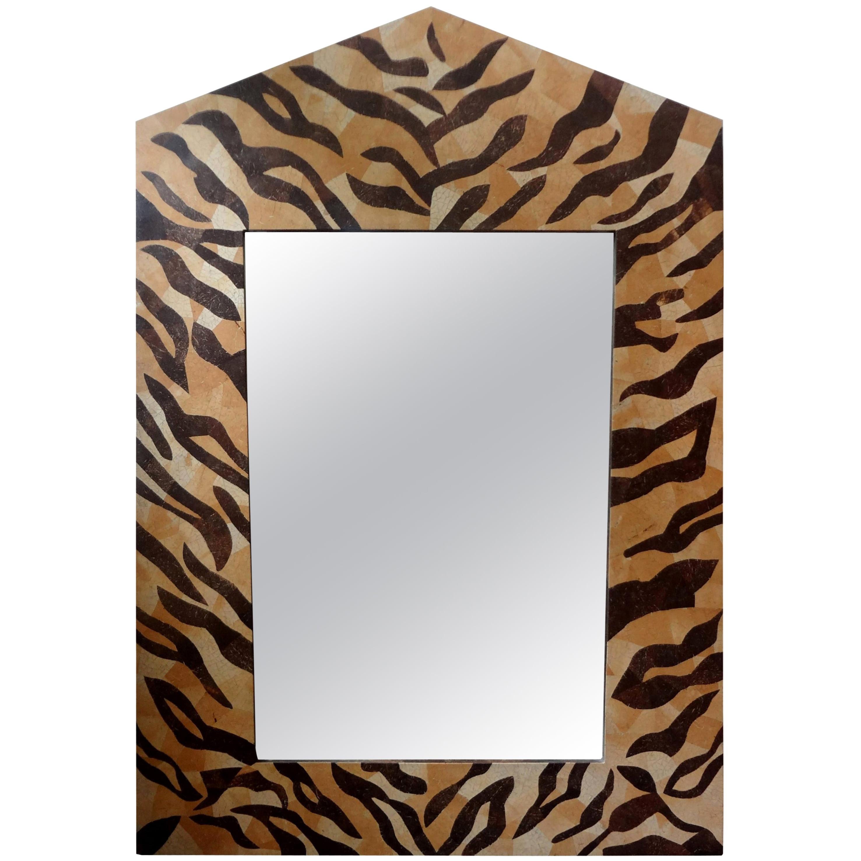 Large unusual midcentury neoclassical style coconut shell mirror. This stunning midcentury Karl Springer style modern neoclassical mirror is made of coconut shell in a leopard pattern. Our versatile mirror would work well in many rooms and