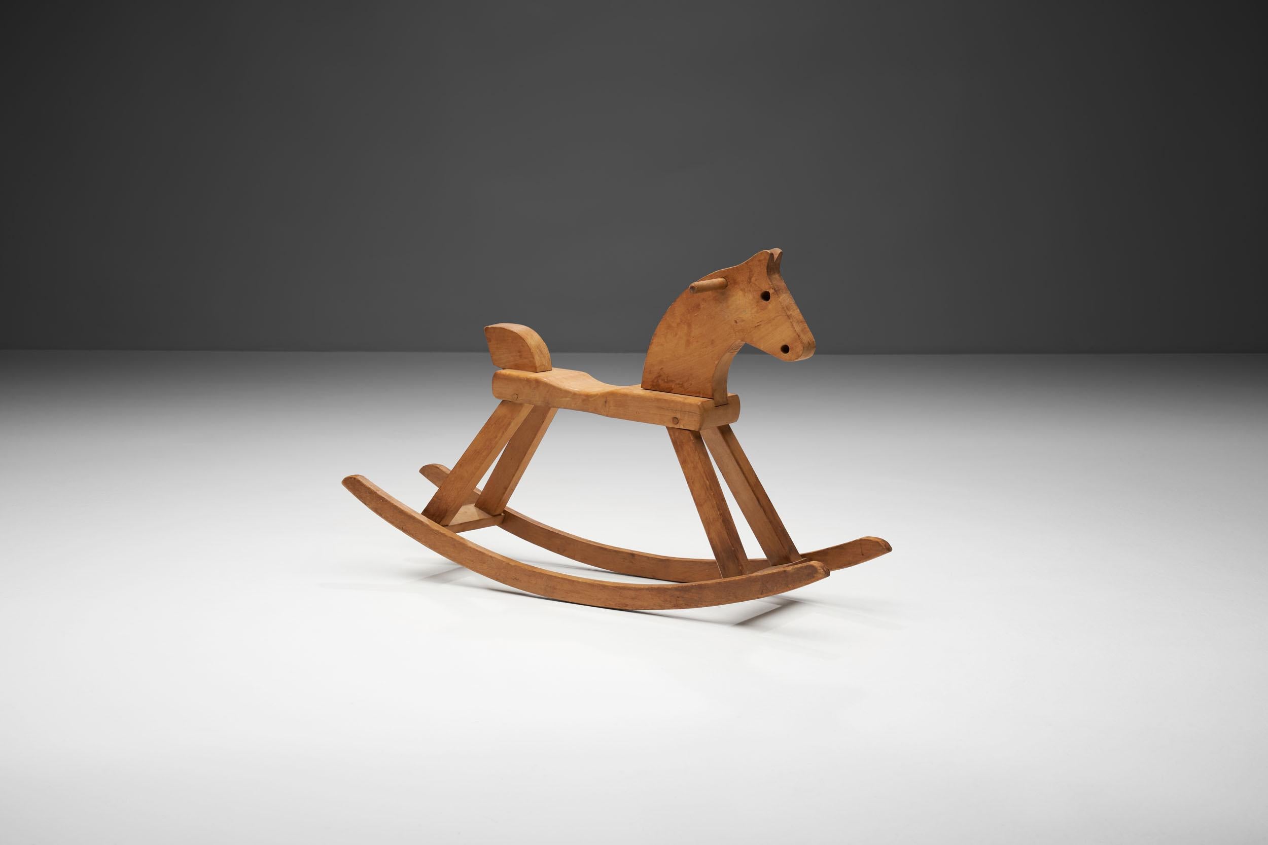 Lacquered beech rocking horse made and marked by Kay Bojesen, Mønsterbesk, Denmark, 1936, and produced, circa 1960s.

This lovely rocking horse has every characteristic of Kay Bojesen. Round and soft edges, with a design that is appealing not only