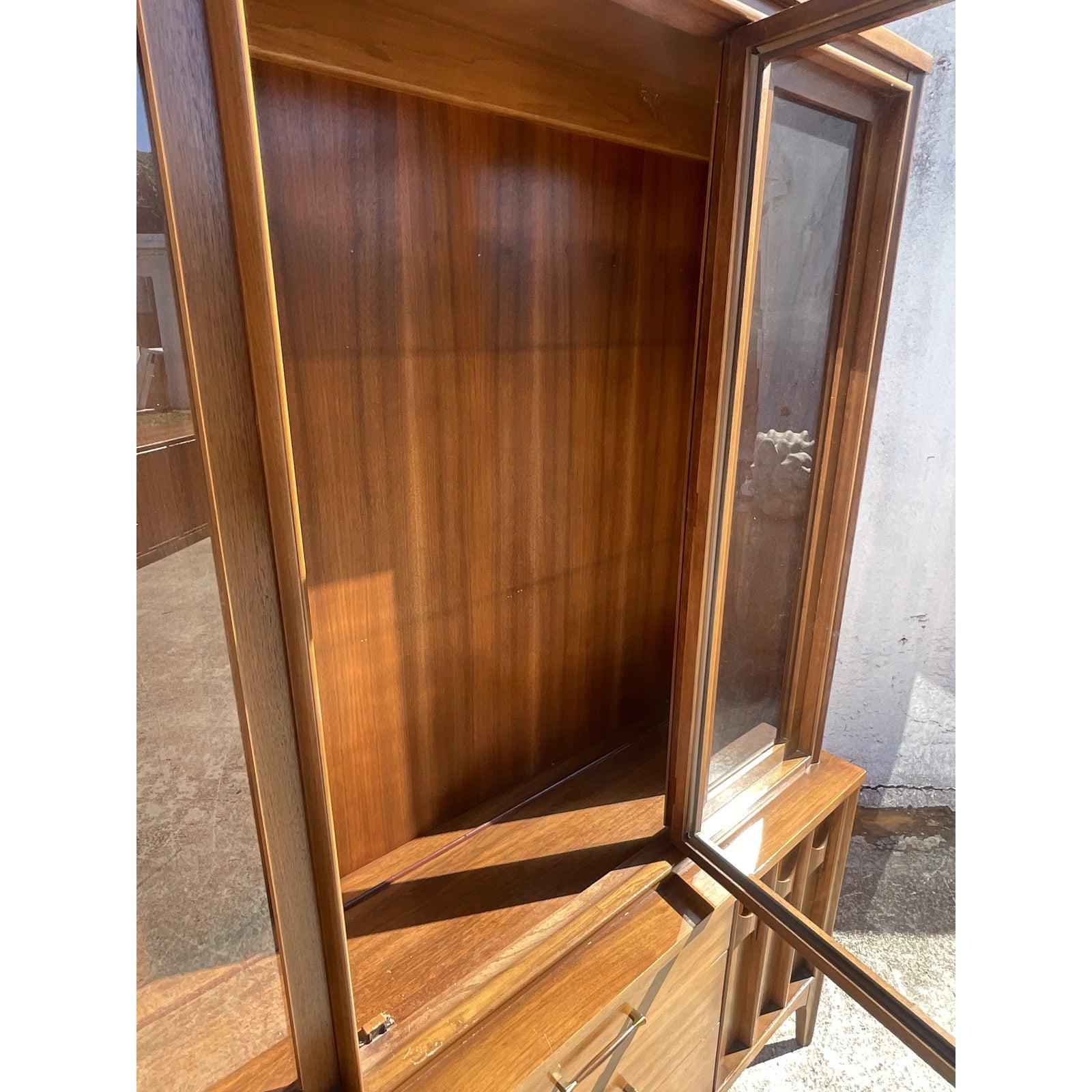 Fantastic vintage Kent Coffey China cabinet. Part of the iconic Perspecta collection. Beautiful carved wood detail and large glass doors. Tall and impressive. Unmarked. Acquired from a Palm Beach estate.