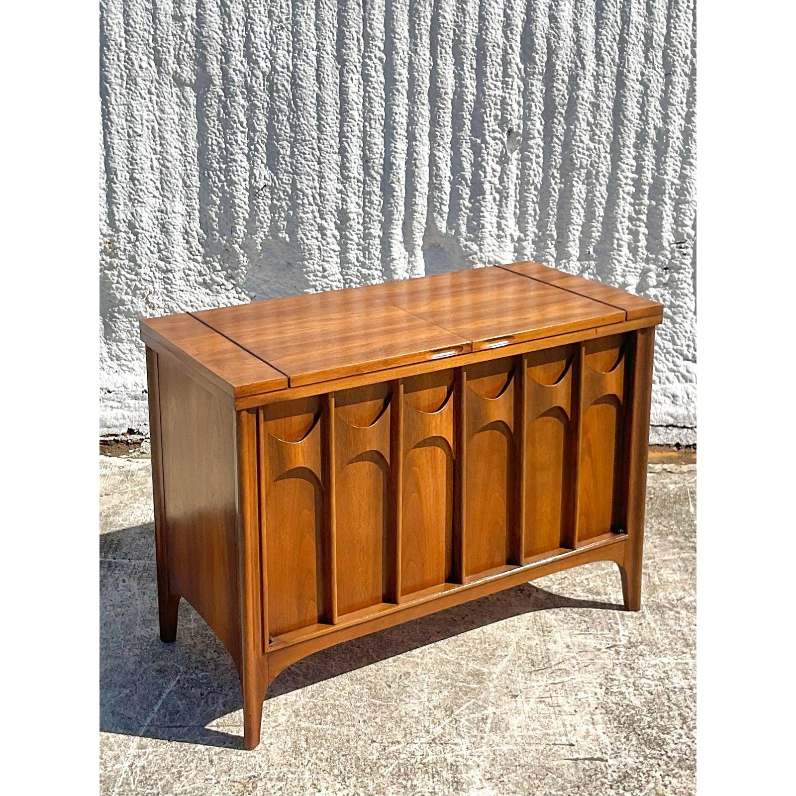 Fantastic Midcentury Kent Coffey sideboard. One of the pieces of the iconic Perspecta collection. Beautiful flip top opens to reveal lots of great additional surface space for entertaining. Perfect as a sideboard or even a dry bar. A real stylish