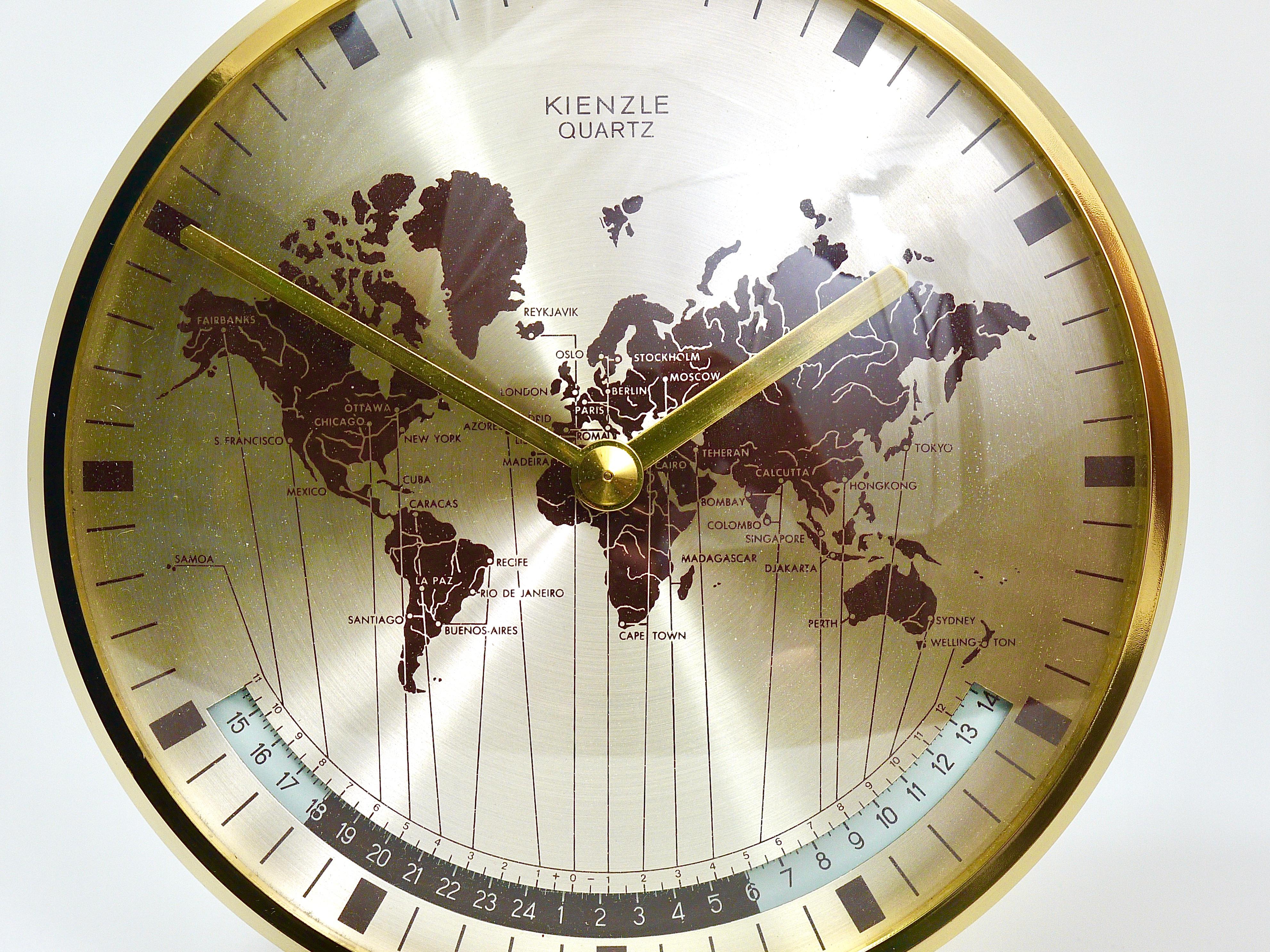 A beautiful modernist brass desk clock with a world map clocks face and world time zones. Executed in the 1960s by Kienzle, Germany. Original battery movement. In very good condition.