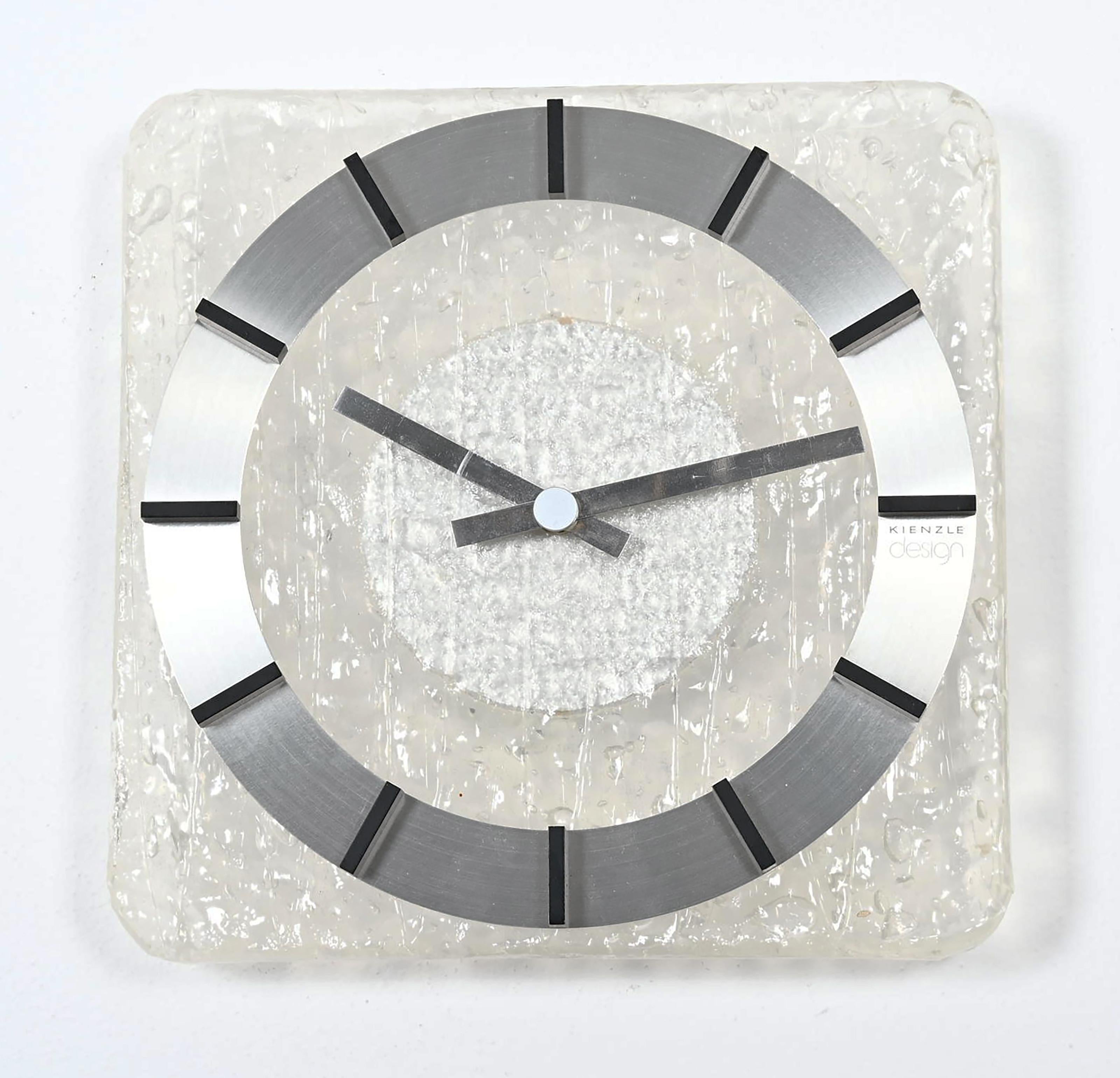 Rare rectangular lucite wall clock face with aluminum black painted hands and aluminum index made by Kienzle in the late, 1960s. Fitted with a modern quartz movement with a battery.