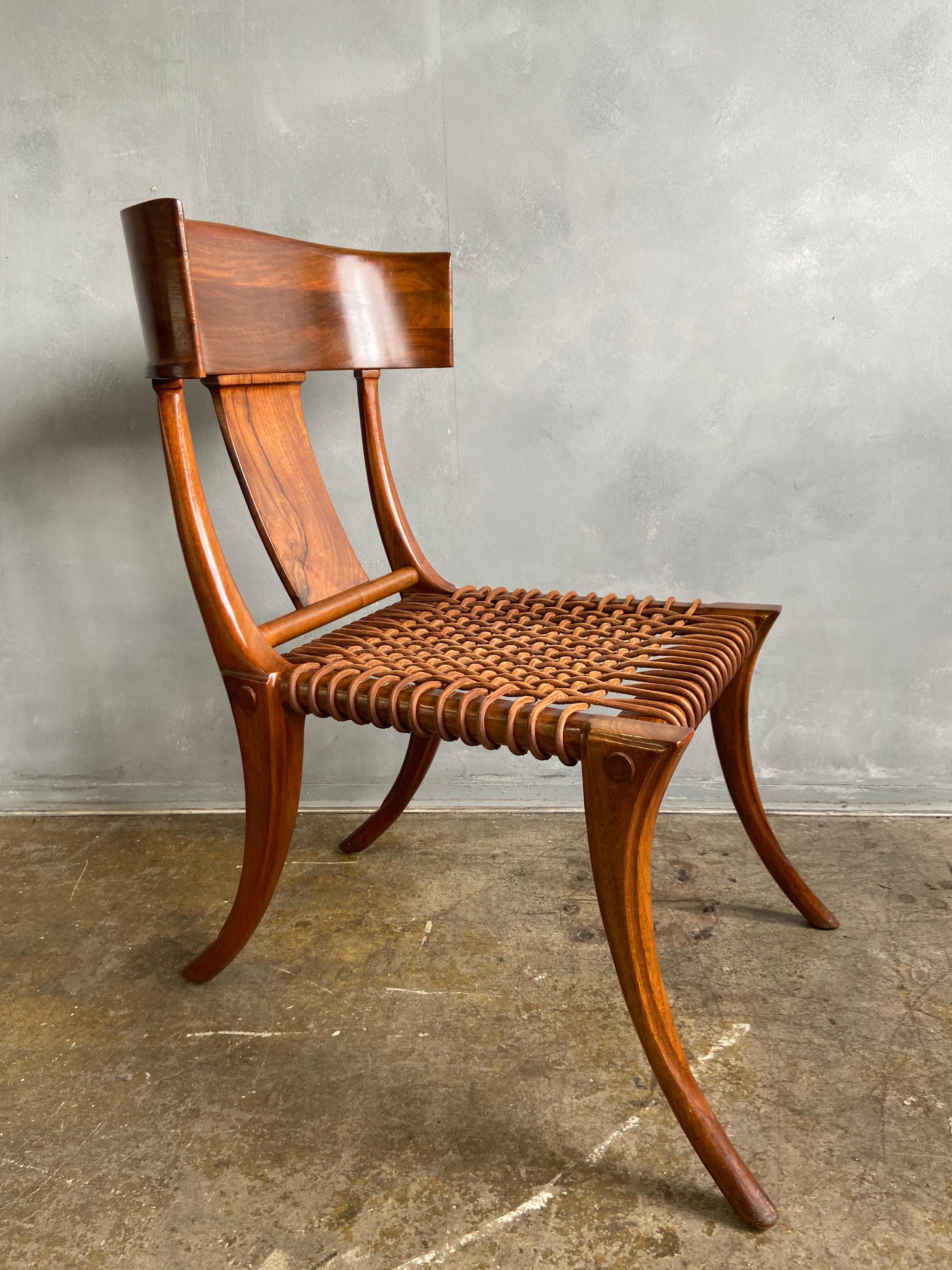 For your consideration is this set of 4 Klismos chairs with leather cord. This came from a larger set that had the Saridis tag on the underside but these do not. T. H. Robsjohn-Gibbings Klismos chairs varied slightly throughout the years and was