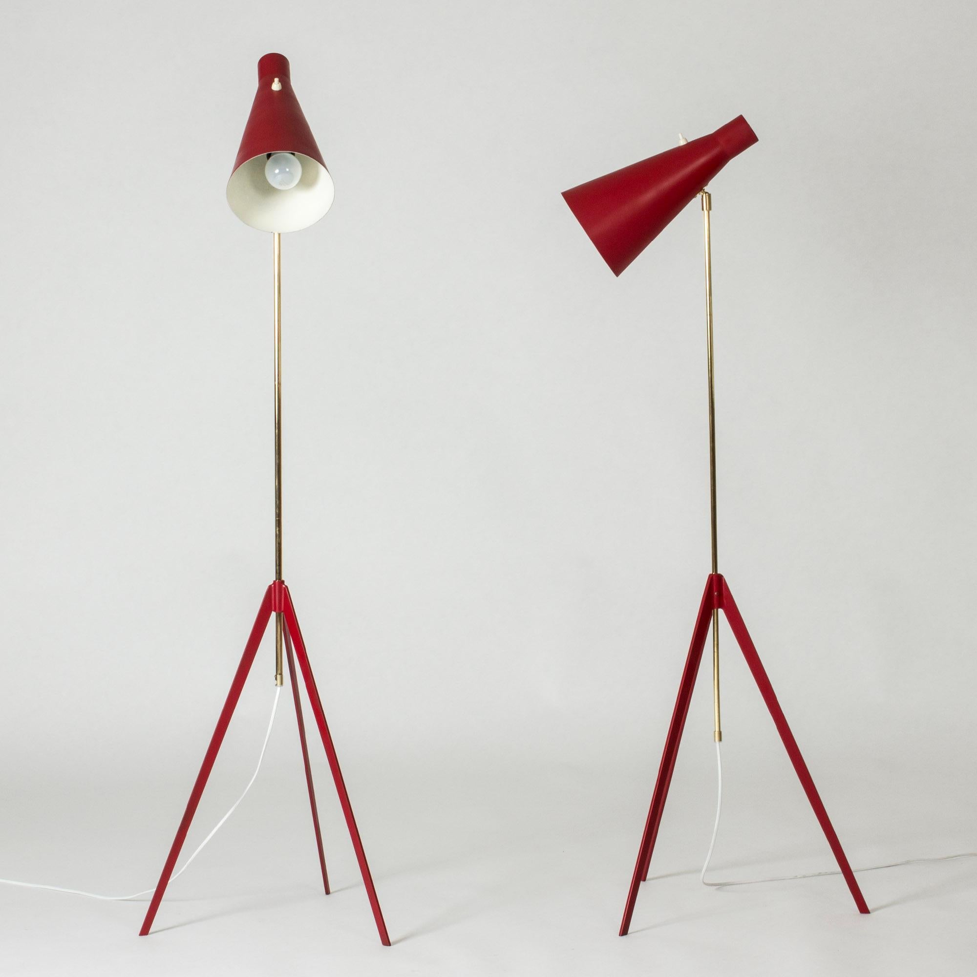 Pair of very cool brass and red lacquered metal floors lamp by Alf Svensson. Minimalistic, distinct design with a sharp-cut tripod bases.