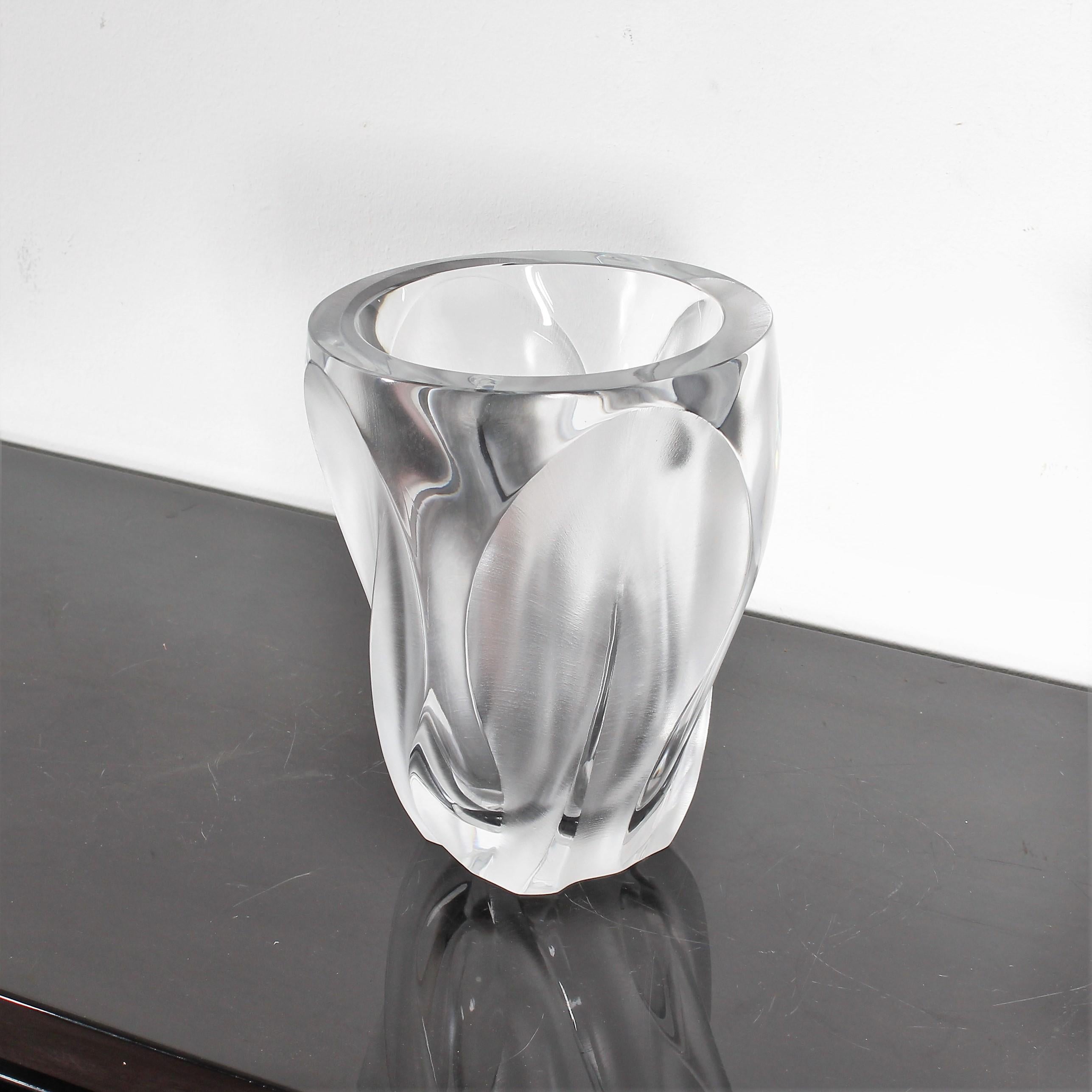 Lalique Ingrid vase designed by Marc Lalique in the 1960s. Made of a single block of transparent crystal with satin-finished petals in four sides. Signature Lalique France engraved on the bottom. Wear according to age and use.

   