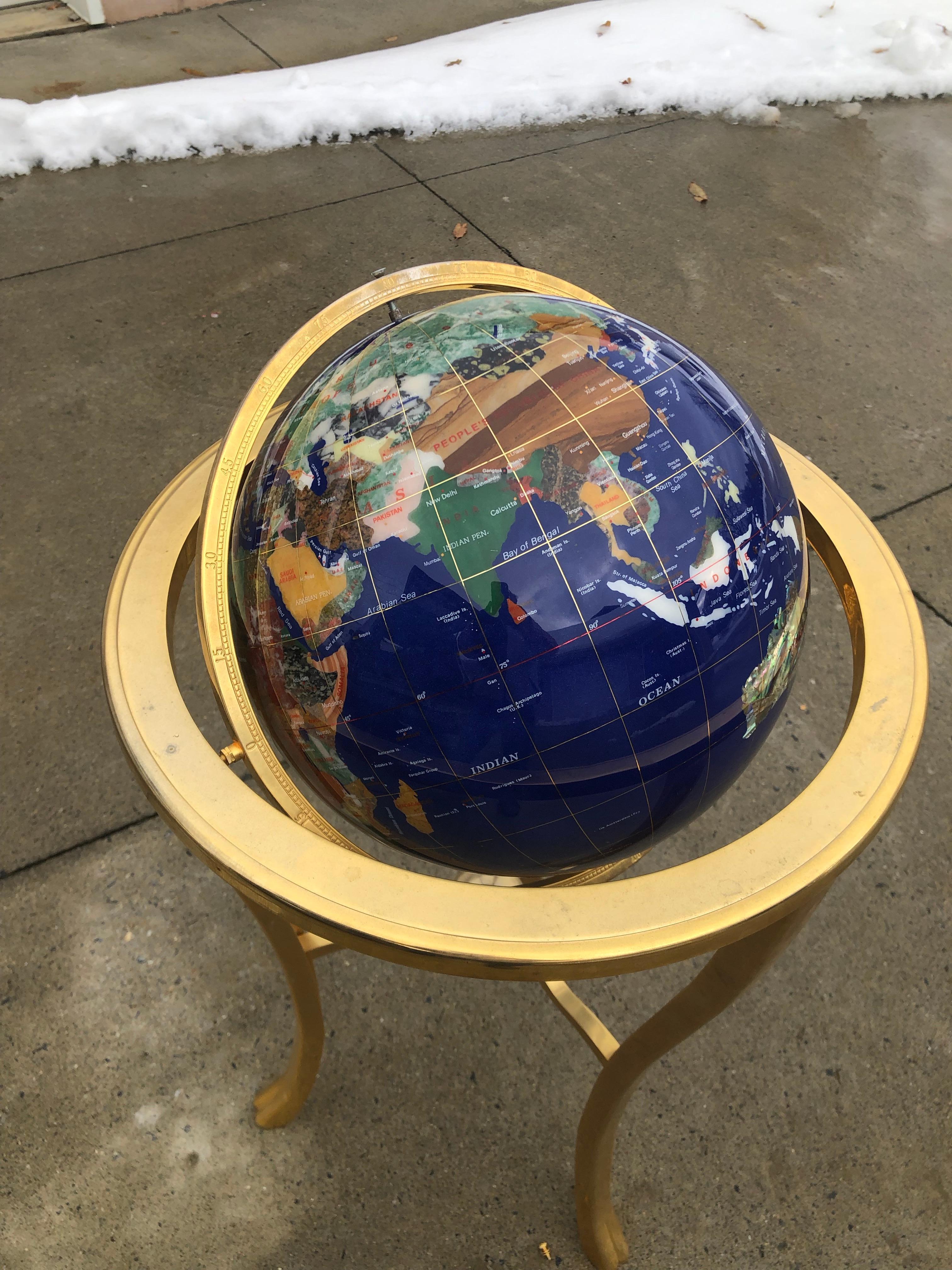 Midcentury lapis world globe on brass stand
Measures: 37