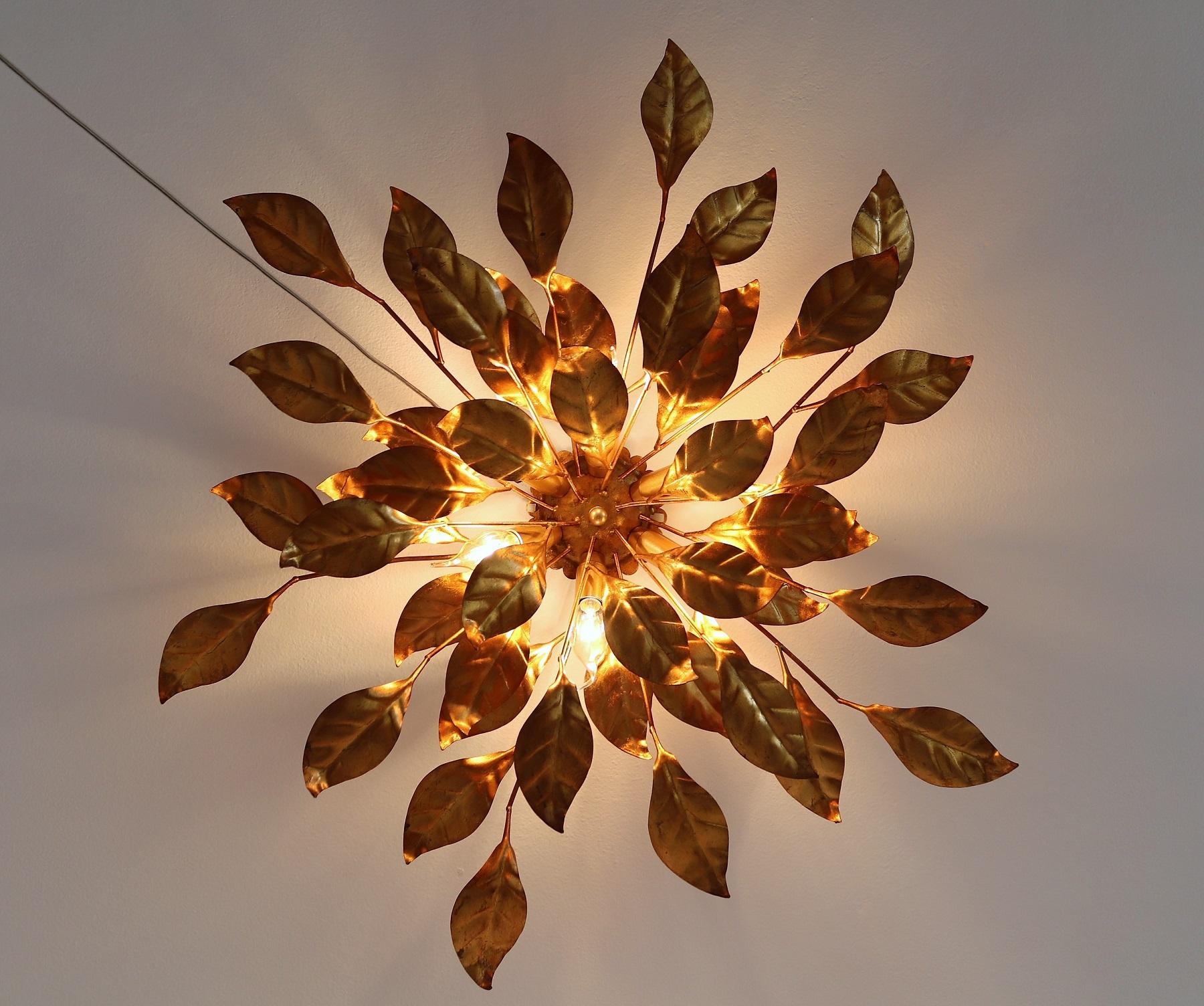 Gorgeous large leaf flushmount ceiling light or wall light manufactured by Hans Kögl in the 1970s.
Large sized rosette made from multiple gilt, strong leaves
Scalloped central rose, with original gold leaf finish.
Equipped with 6 new bulb holders