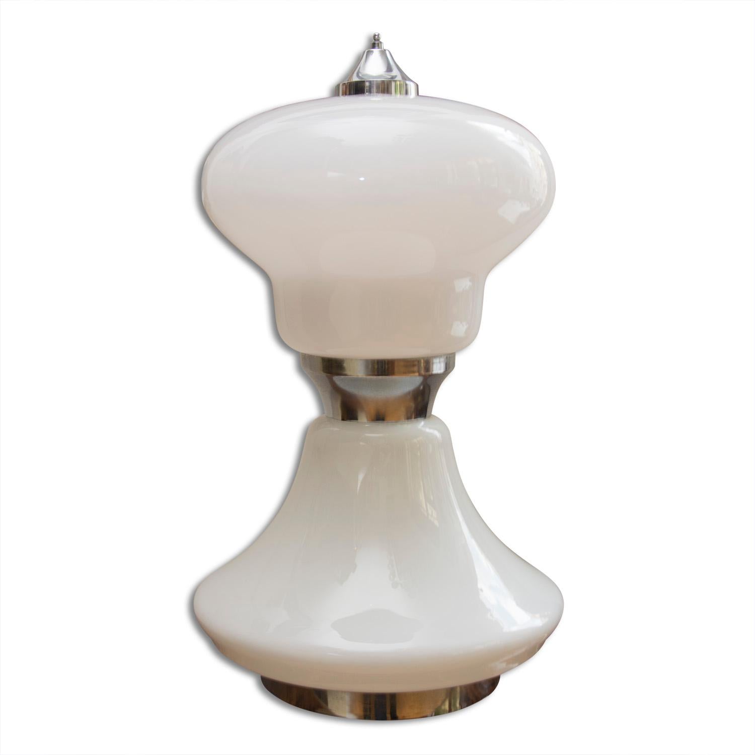 Large table lamp made of milk glass with chrome base. It was made in Italy in the 1960s. It features several variants of color illumination. The lamp is dismountable to two parts. In excellent condition, has a new wiring.
