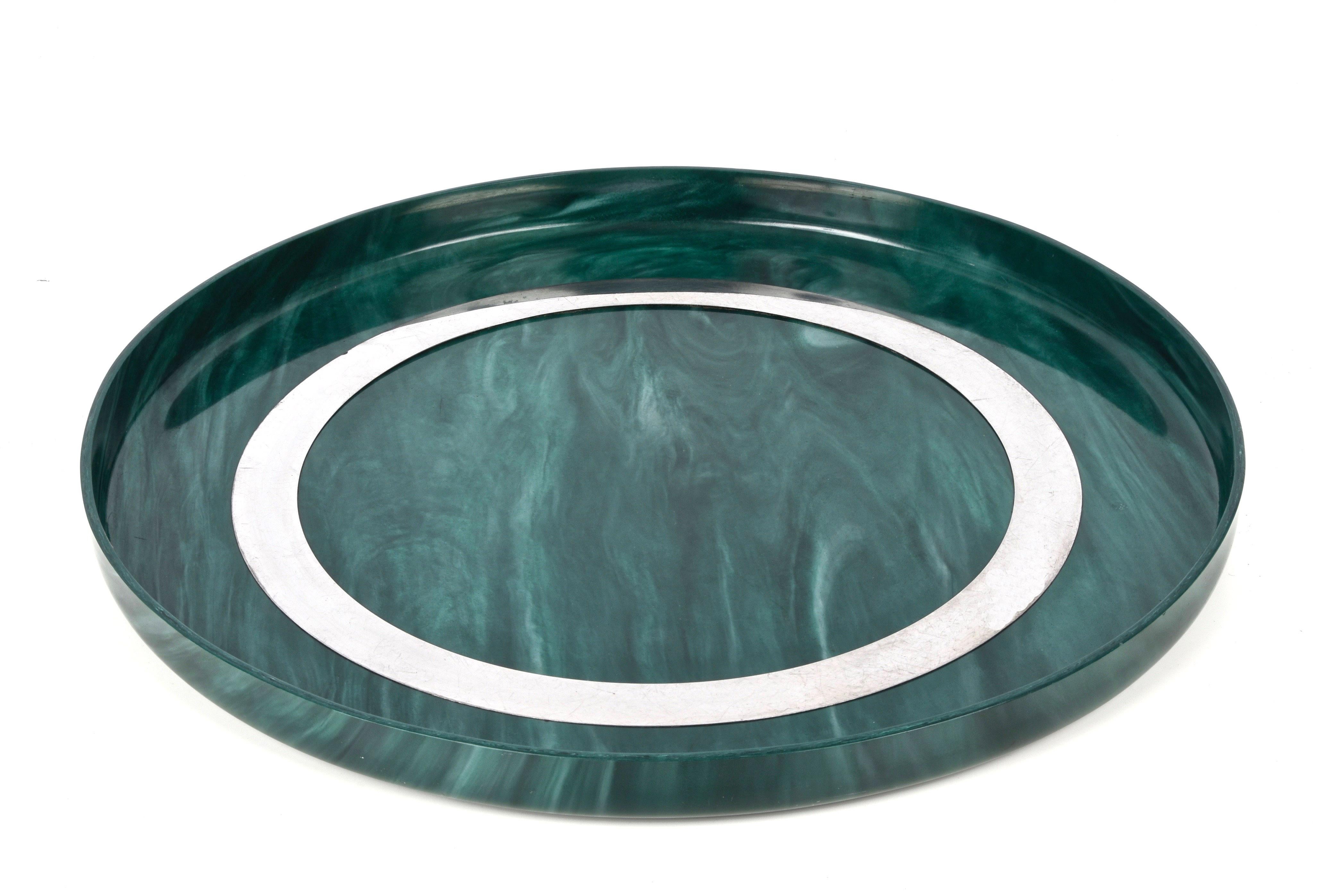 Wonderful mid-century emerald green bakelite serving piece. This wonderful piece is based on a drawing in the style of Willy Rizzo and was made in Italy during the 1980s. 

It is an iconic round bakelite tray with a steel circle and it will amaze