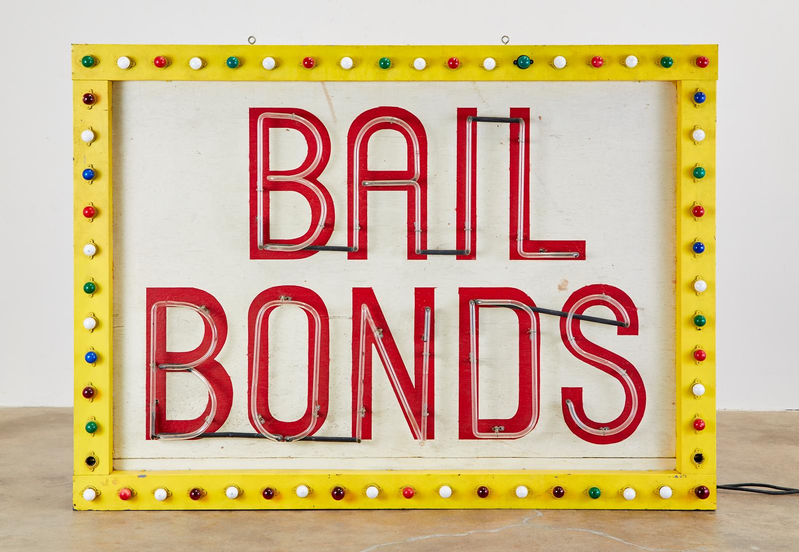 Large, old Las Vegas strip neon sign from the midcentury. Centered by red neon letters spelling Bail Bonds. The frame is constructed from wood covered with zinc sheet metal. There are 60 colored lights that flicker in a synchronized pattern around