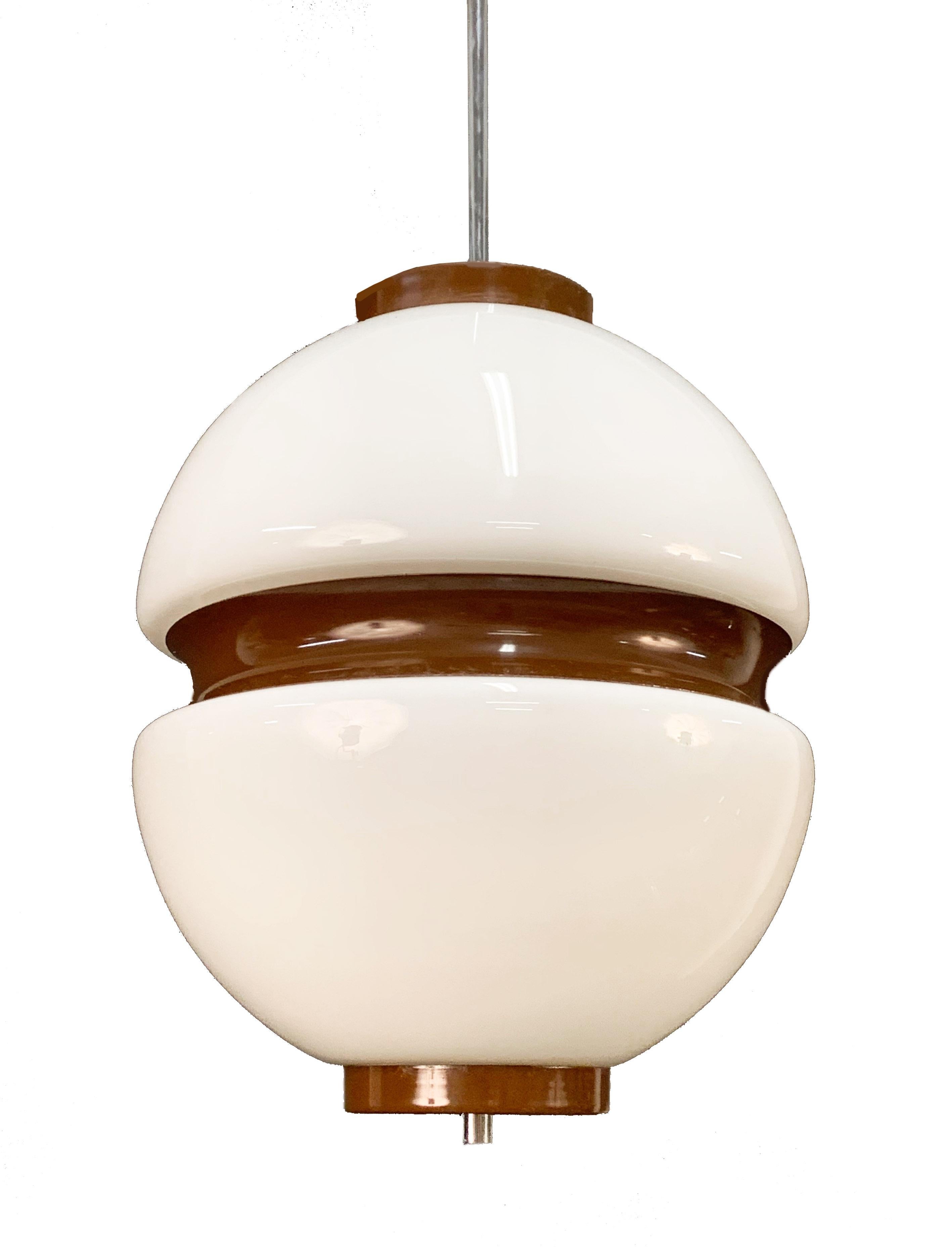 Vintage lattimio glass and brown enamelled aluminium chandelier. This wonderful item was produced in Italy during the 1970s.

The smooth lines of the white glass mix smoothly with the brown aluminium producing an elegant effect.

This piece will