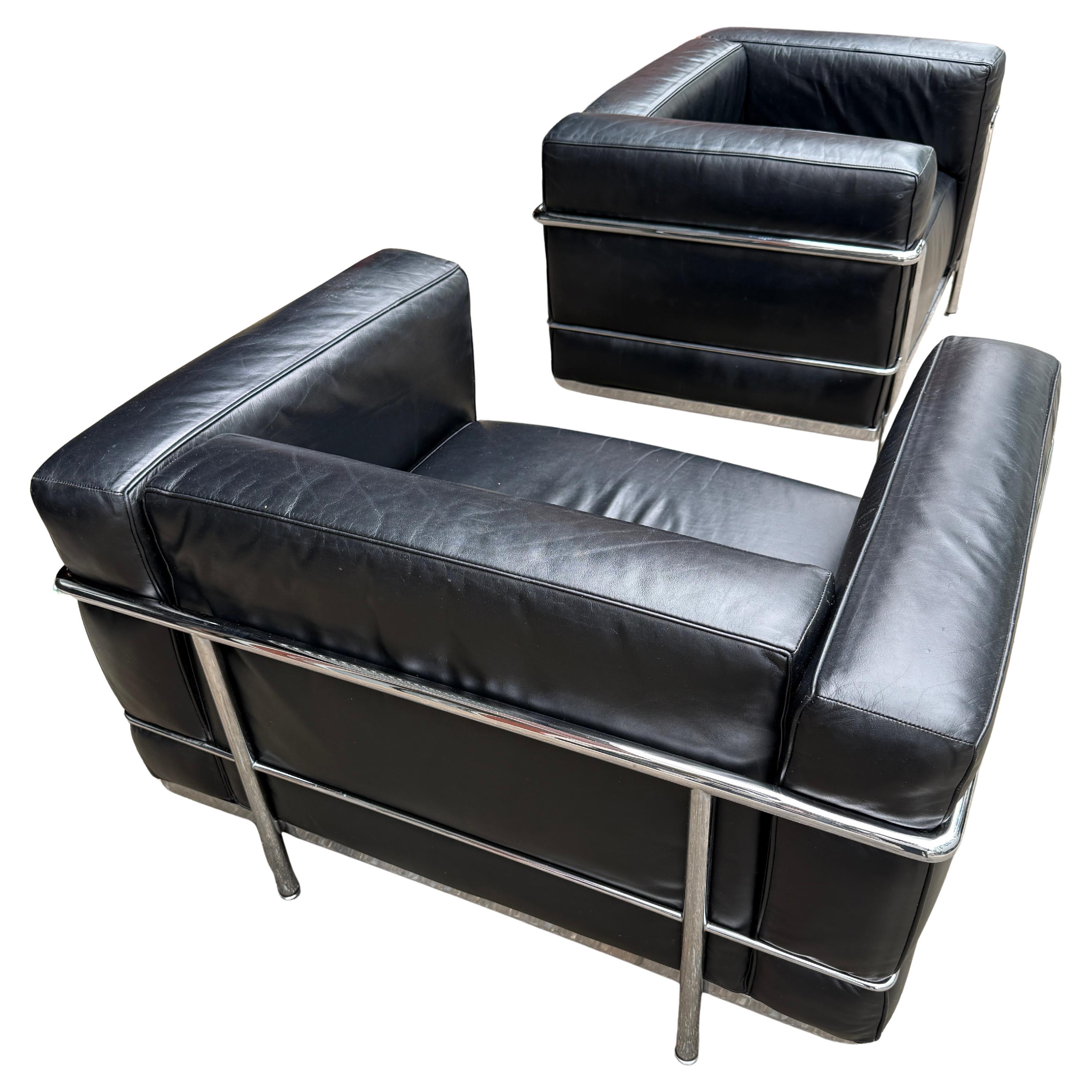 Created as a modernist response to the club chair and almost a century later, nothing has become more iconic then the LC3 Armchair. Featuring black leather with down filled cushions surrounded by a chromed tubular frame. Stamped on the frame Cassina