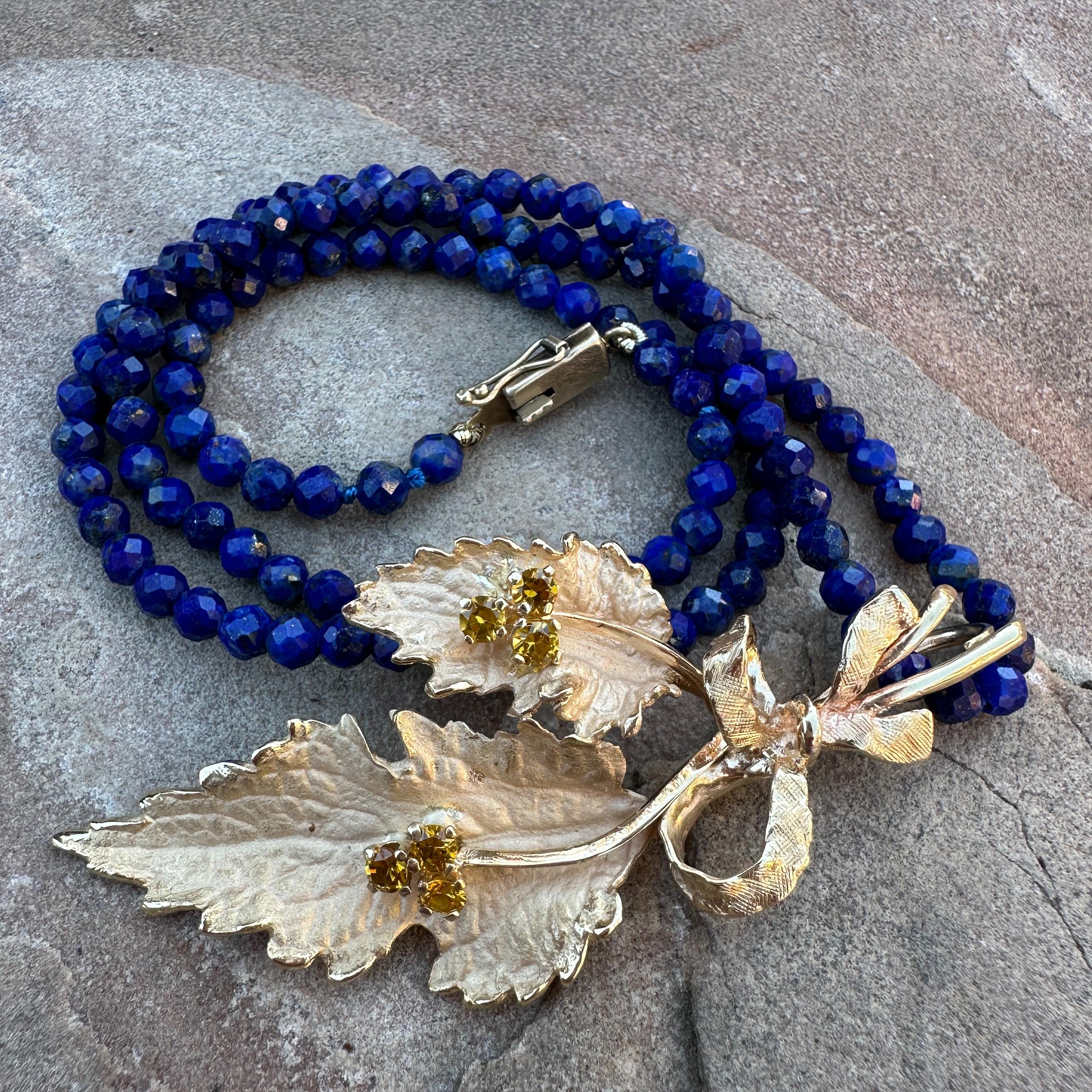 Mixed Cut Mid-Century Leafy Sprig Pendant with Citrines in Yellow Gold on Lapis Bead Chain For Sale
