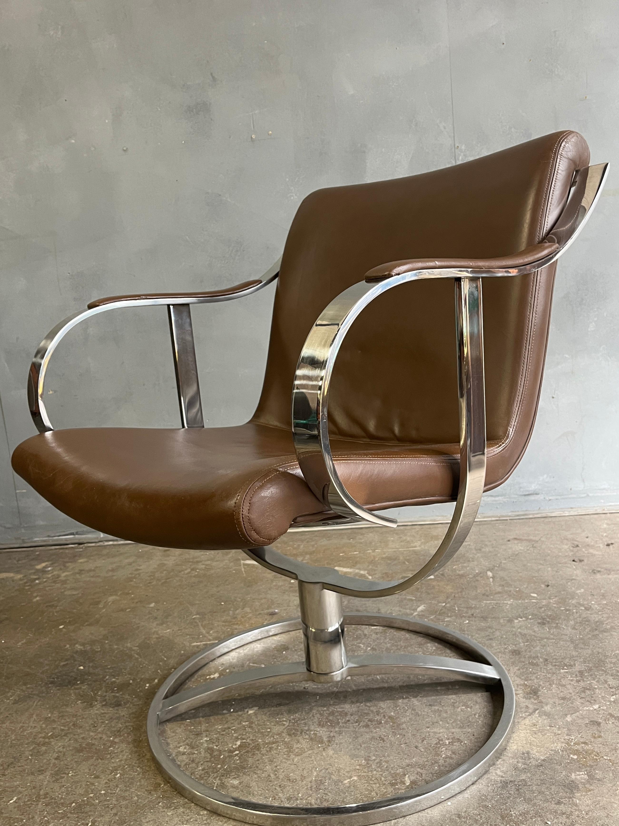 Gardner Leaver for Steelcase Easy chair in saddle brown leather. Chrome is in good shape with no rust. Has just the right angle to be used as an office chair, reading chair or even lounge chair. Swivels 360 with ease. This is a very solid heavy