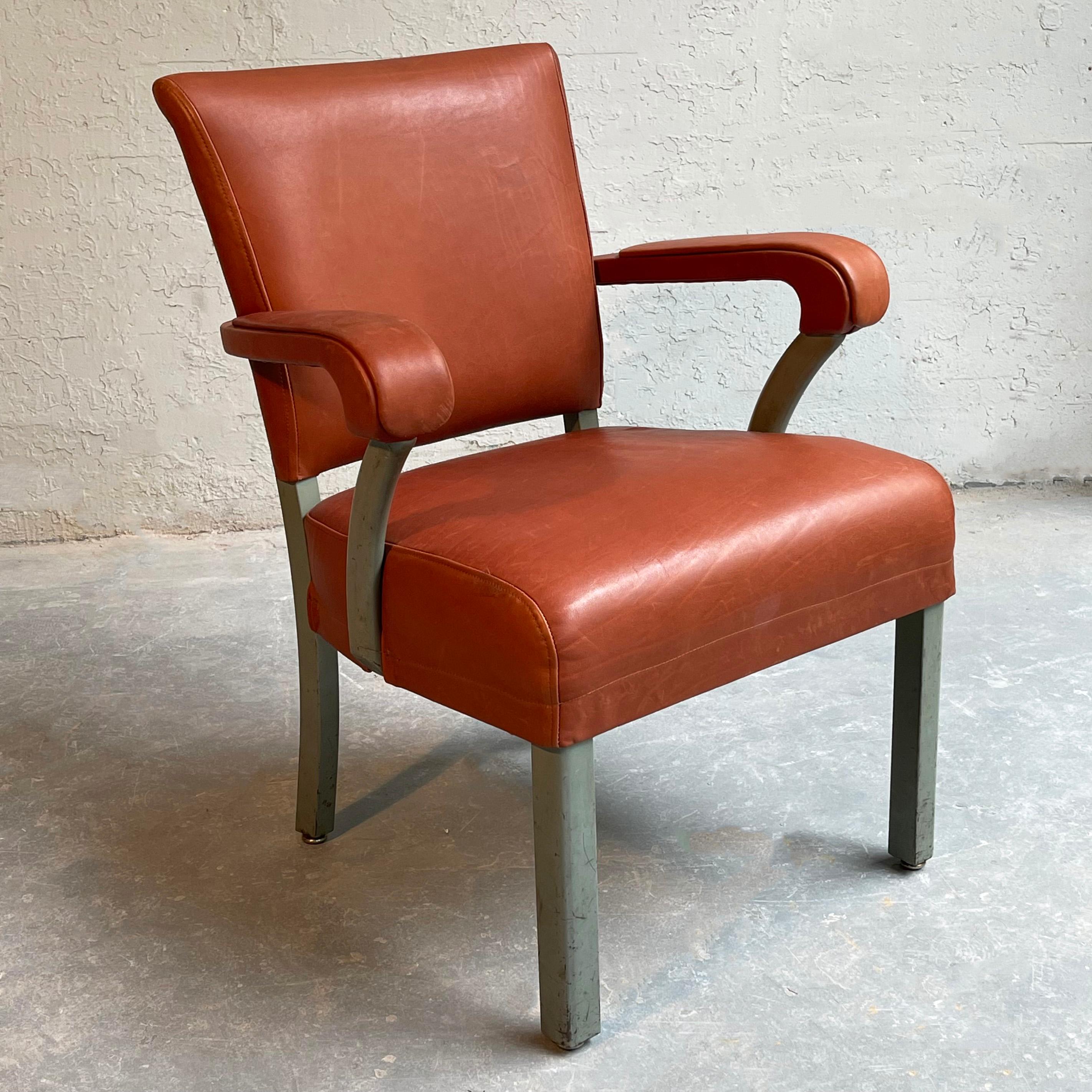 Midcentury, painted steel, office, armchair by Remington Rand is newly upholstered in rich rust leather.