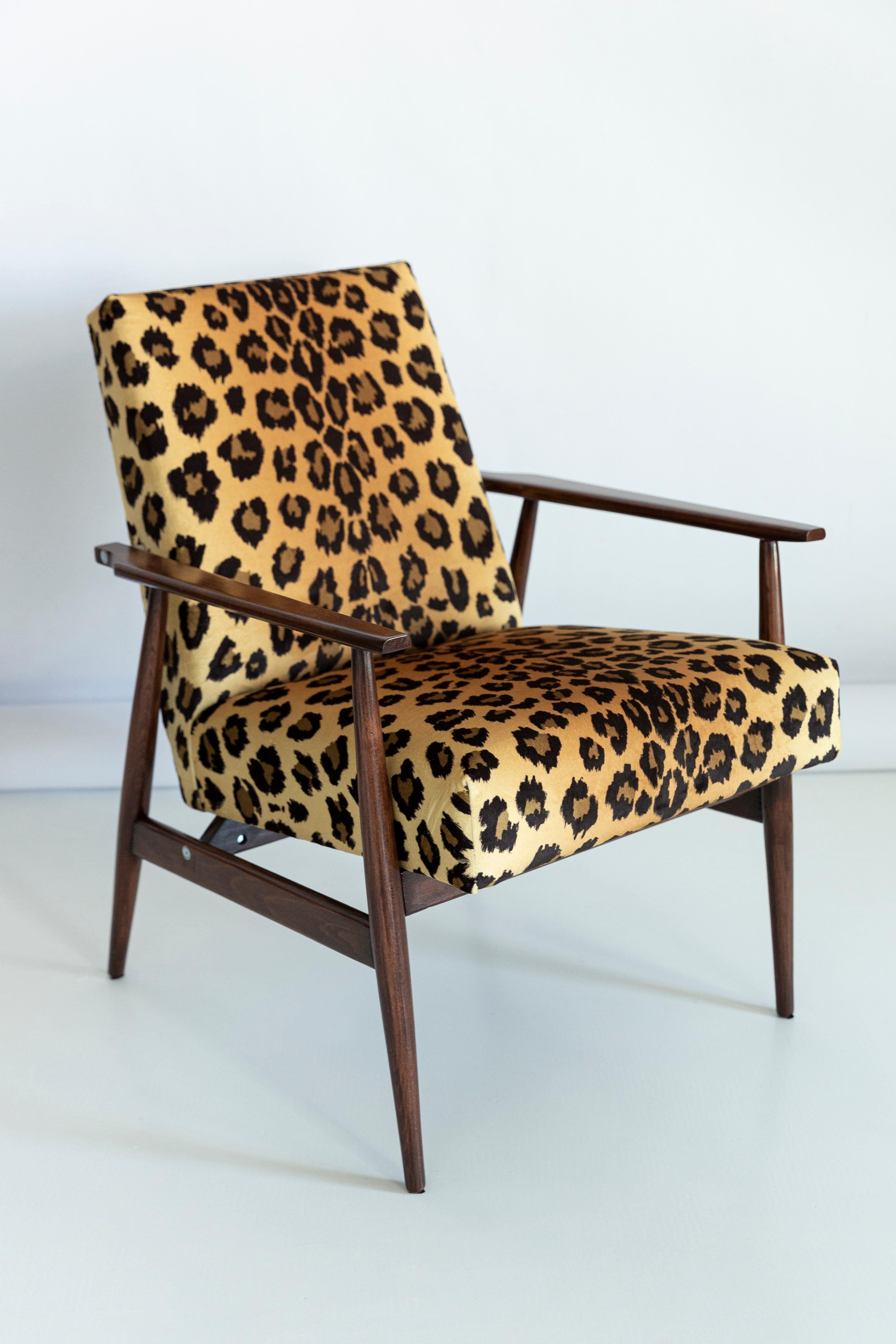 A beautiful, restored armchair designed by Henryk Lis. Furniture after full carpentry and upholstery renovation. The fabric, which is covered with a backrest and a seat, is a high-quality Italian velvet upholstery printed in leopard pattern. The