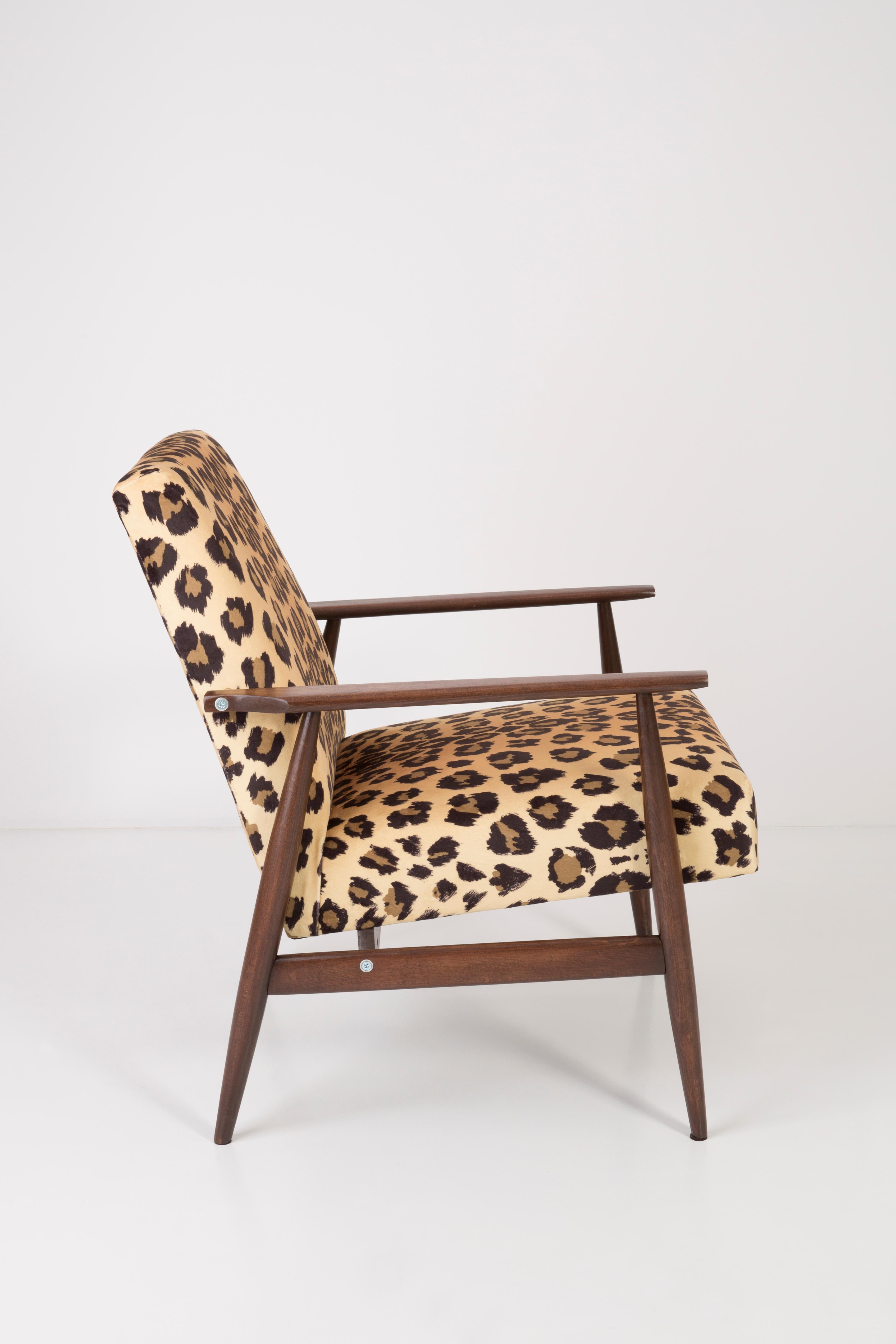 A beautiful, restored armchair designed by Henryk Lis. Furniture after full carpentry and upholstery renovation. The fabric, which is covered with a backrest and a seat, is a high-quality Italian velvet upholstery printed in leopard pattern. The