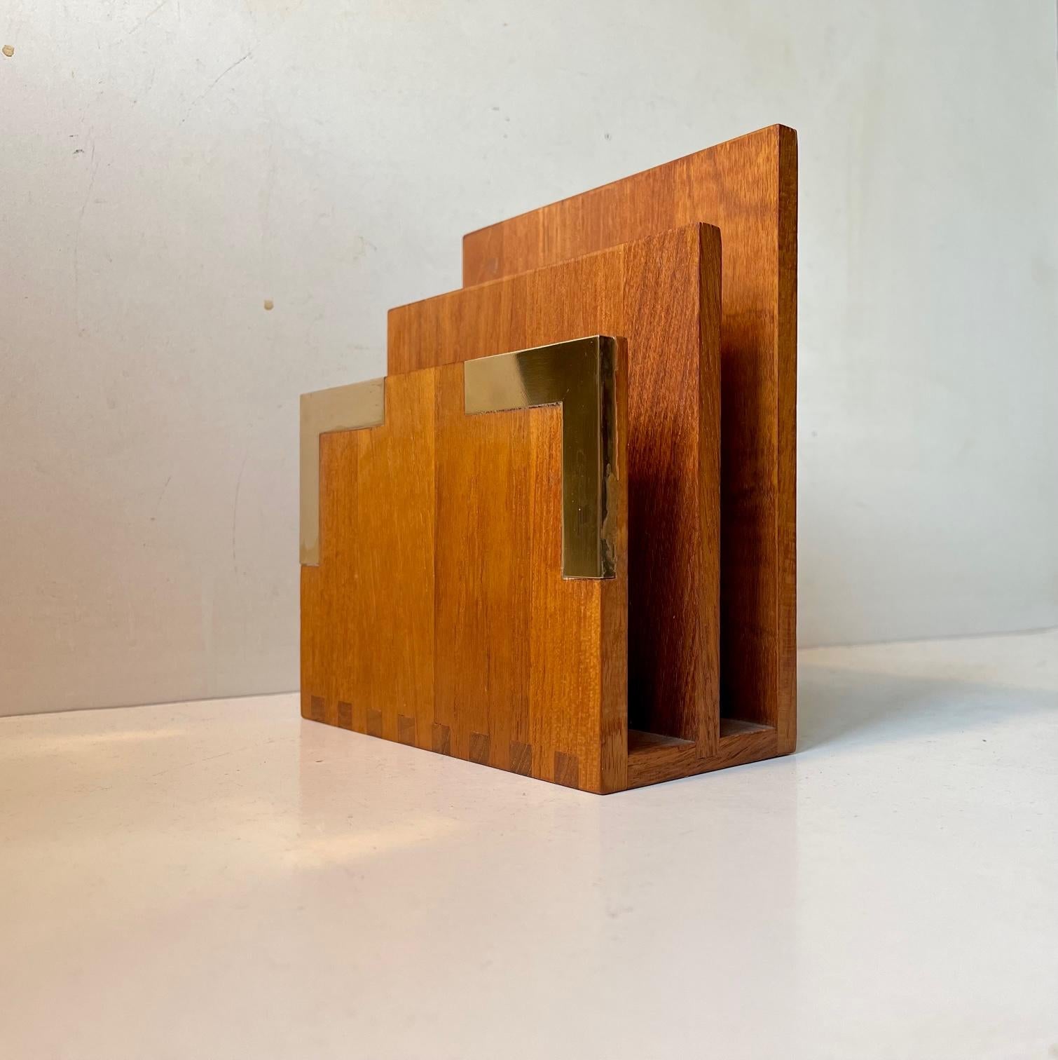 A rare letter desk organizer for letters or documents. Beautiful handmade details and high-lighting inserted brass panels. Designed and made by Richard Nissen in Denmark circa 1960. Nissen made most of IHQ - Jens Harald Quistgaard teak deigns.