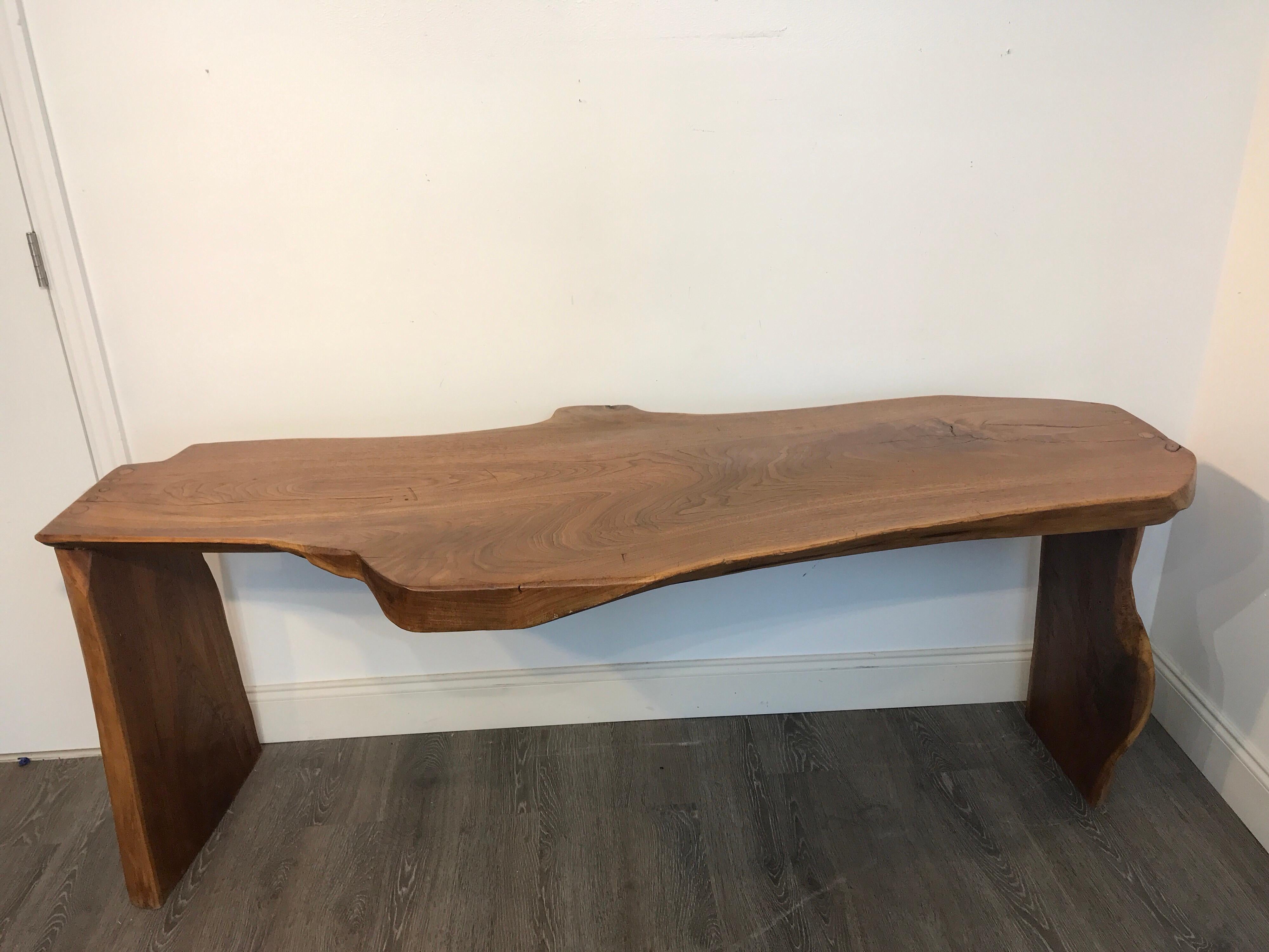Stunning midcentury live edge walnut slab console table, beautiful pegged construction. The organic form the top widths are approximately 19.5