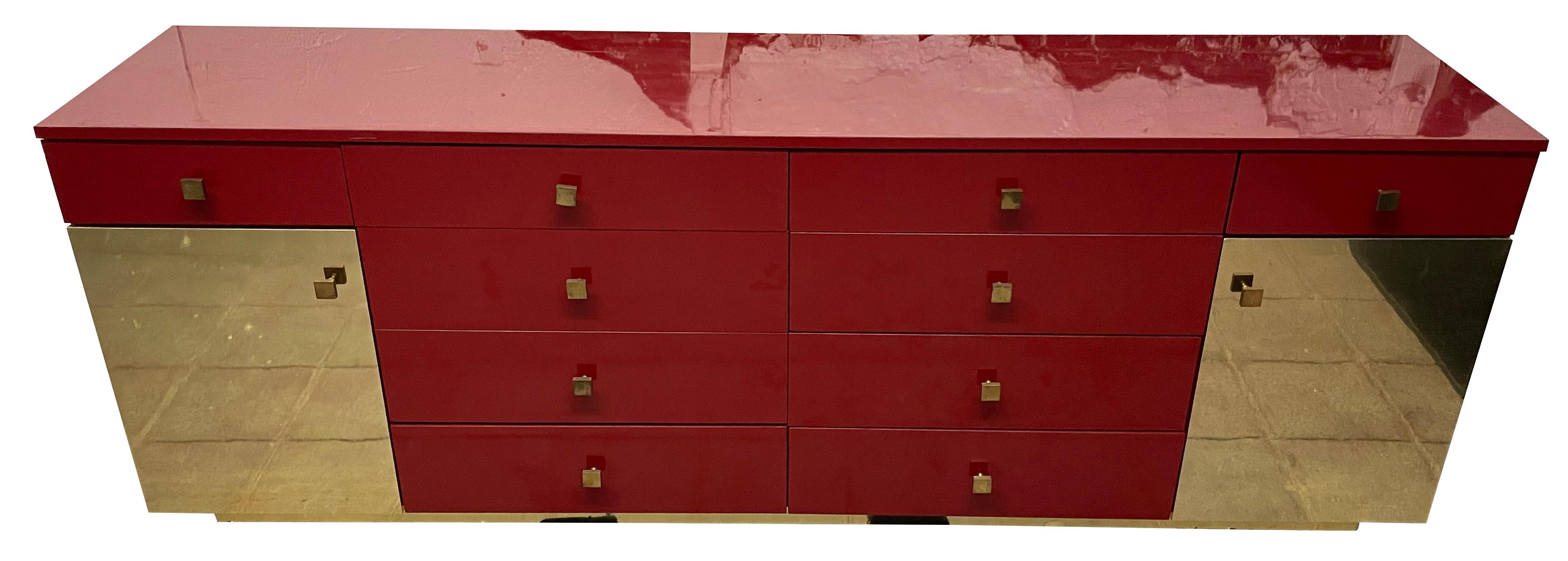 Sexy gloss red and gold mirror laminate custom 10-drawer dresser credenza with 2 cabinets with 4 white adjustable shelves circa 1980 / 1990s custom made. Has solid brass square pulls. In Vintage condition shows normal wear. Look at photos. Very