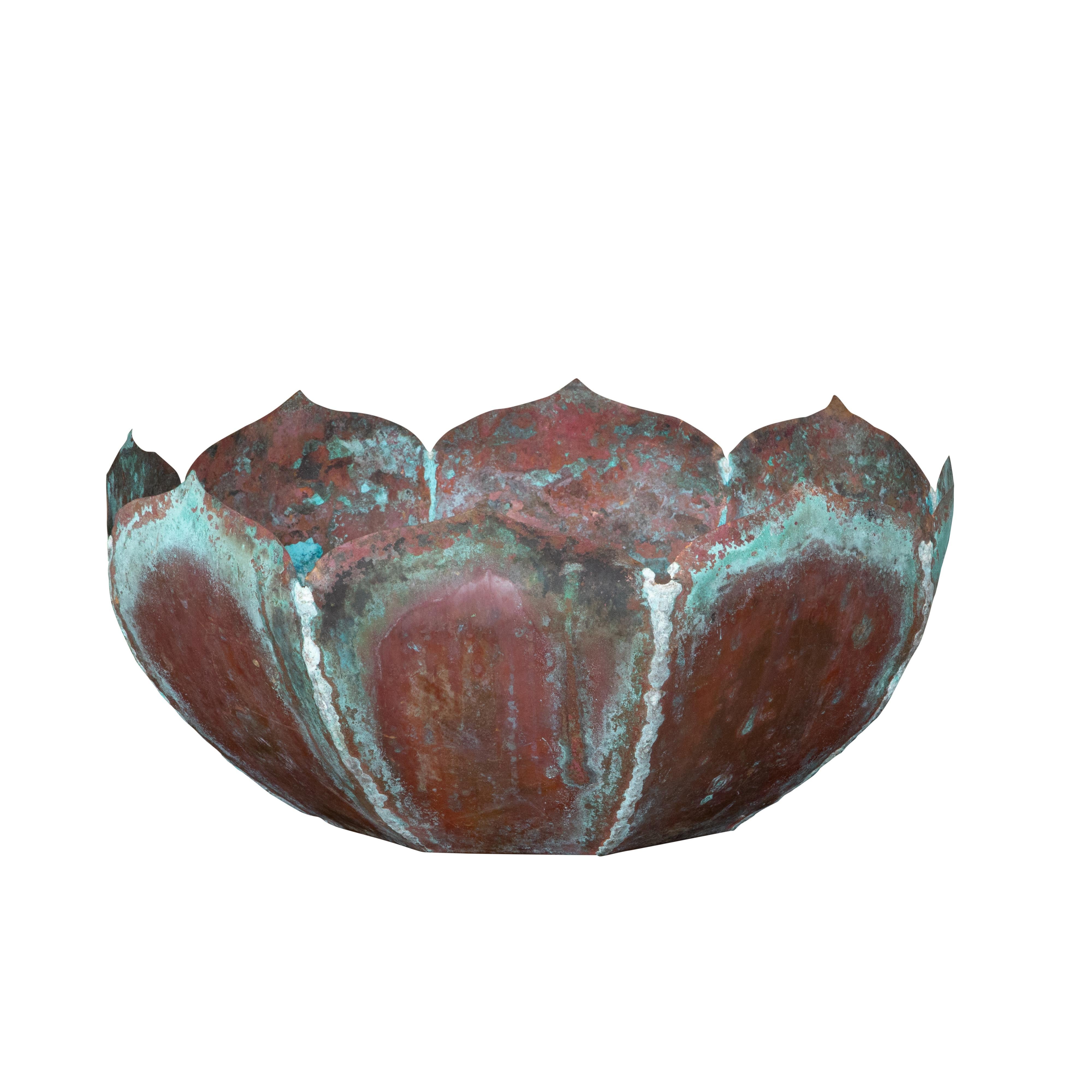 A vintage copper lotus flower shaped decorative bowl from the Mid-20th Century, with verdigris patina adorning the petals. Created during the midcentury period, this rustic decorative bowl attracts our attention with its lotus flower shape and