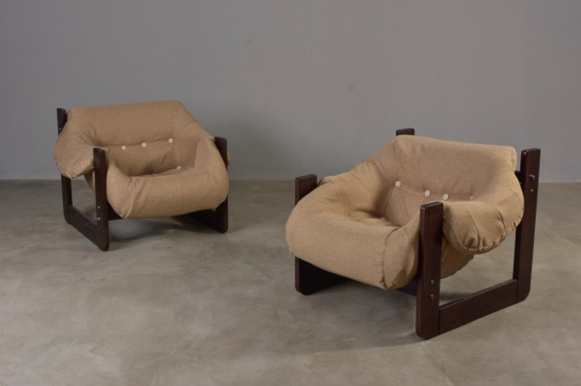 In his designs, Percival Lafer sought ergonomy and comfort.  This pair of Mid-Century Modern lounge chairs by Percival Lafer comprises ebonized solid wood and new upholstery. Its unique design and construction make this an authentic statement piece.