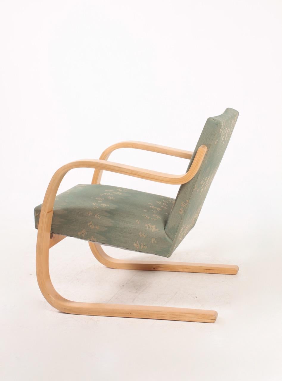 Lounge chair in fabric, model 34. Designed by Alvar Aalto in 1940s for Artek. Original condition.