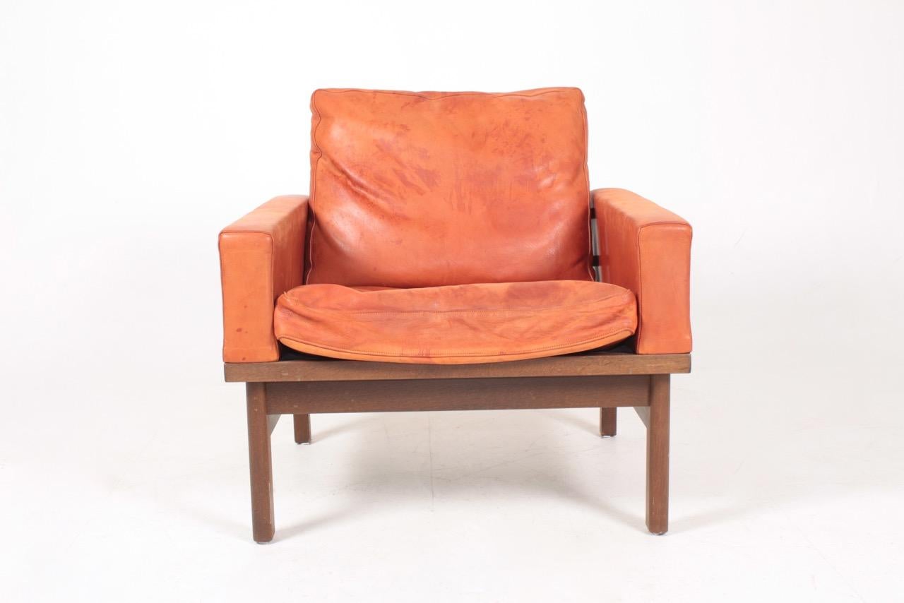Lounge chair in patinated leather designed by Poul Volther for Erik Jørgensen in the 1960s. Made in Denmark. Good original condition.