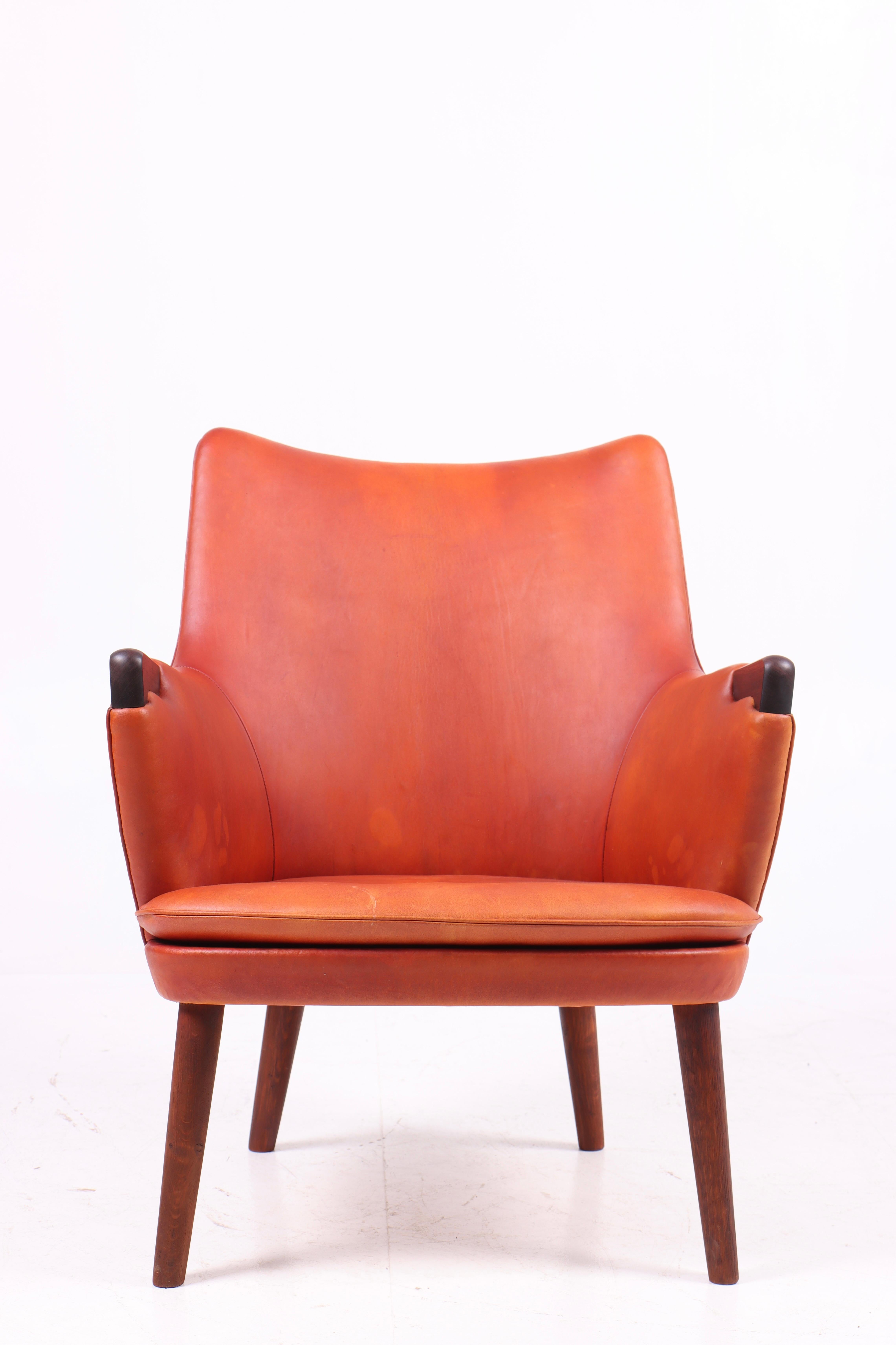 Scandinavian Modern Midcentury Lounge Chair in Patinated Leather & Rosewood by Hans J. Wegner, 1950s For Sale