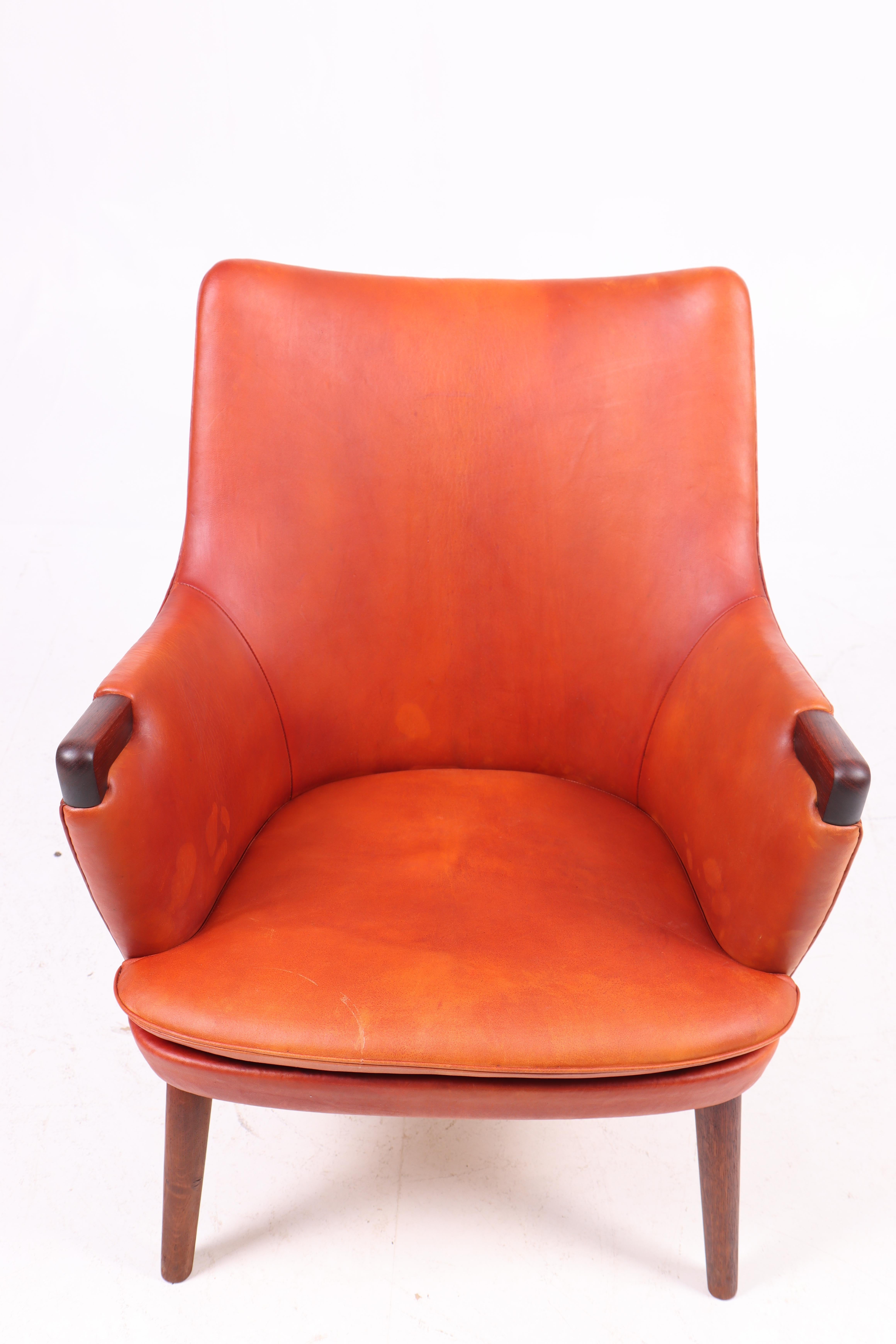 Danish Midcentury Lounge Chair in Patinated Leather & Rosewood by Hans J. Wegner, 1950s For Sale