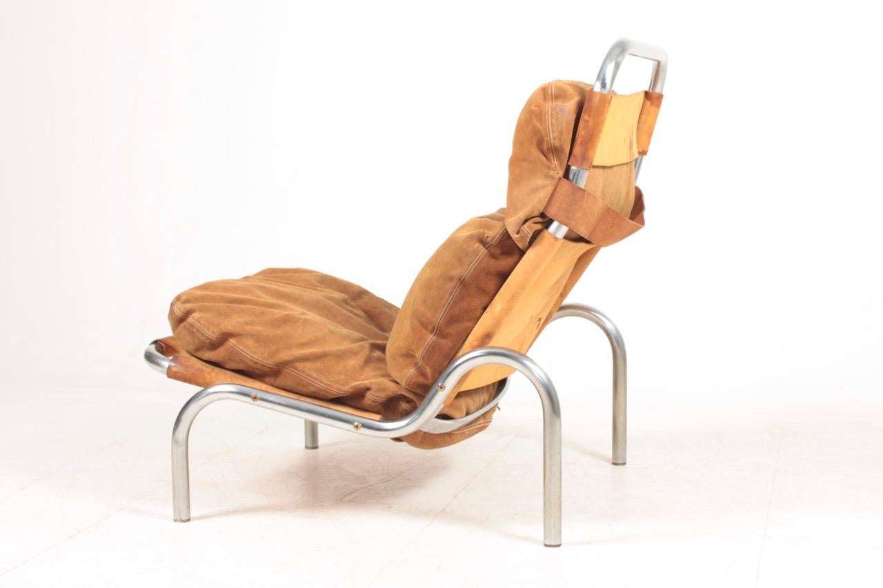 Scandinavian Modern Midcentury Lounge Chair in Patinated Suede and Steel by Erik Jørgensen, 1960s For Sale