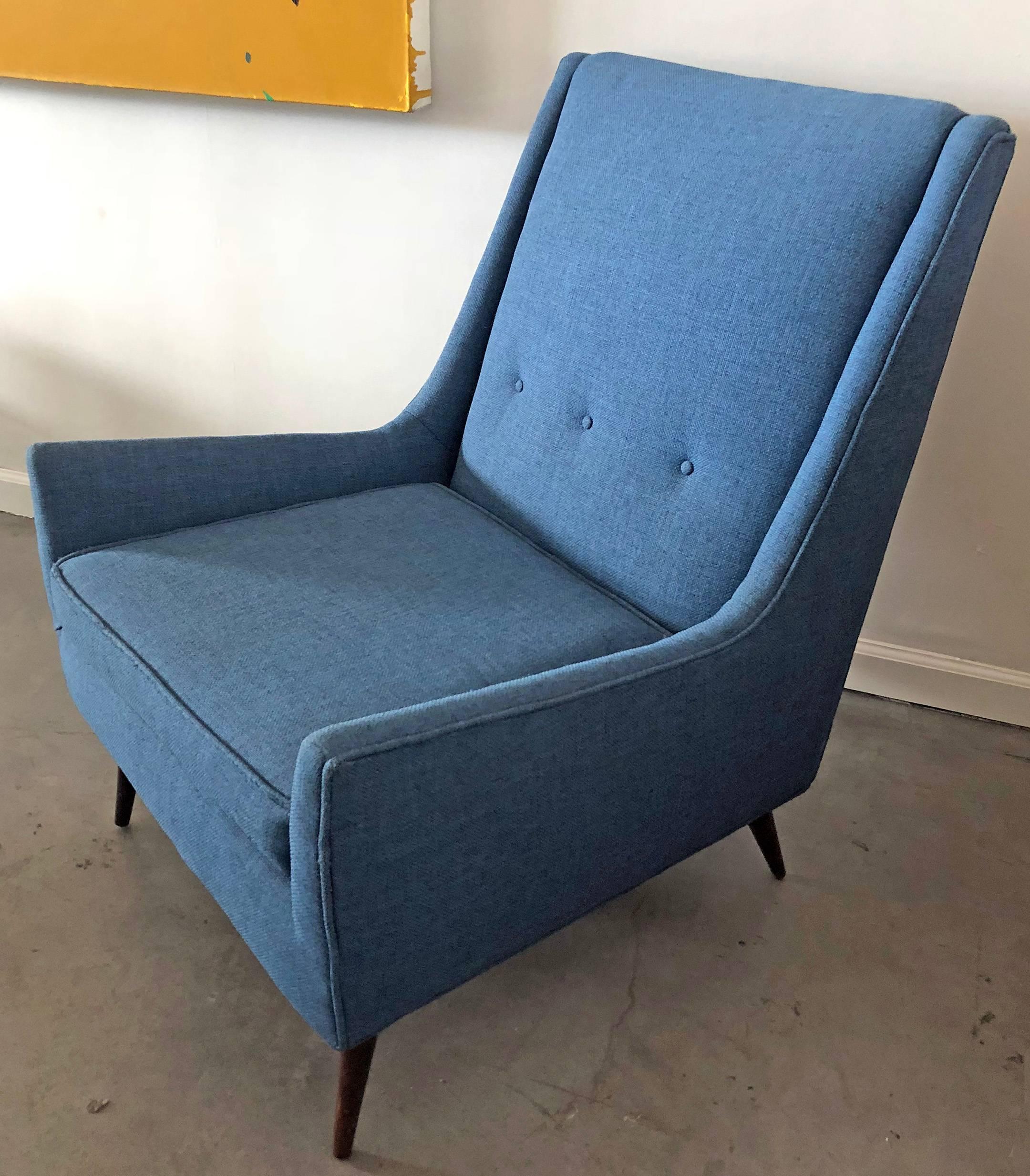 Often attributed to Paul McCobb, this stunning midcentury lounge chair features a clean and timeless design with swooping arms and splayed walnut, Paul McCobb style legs. 

Not only is this piece stunning to look at, it's also quite comfortable!