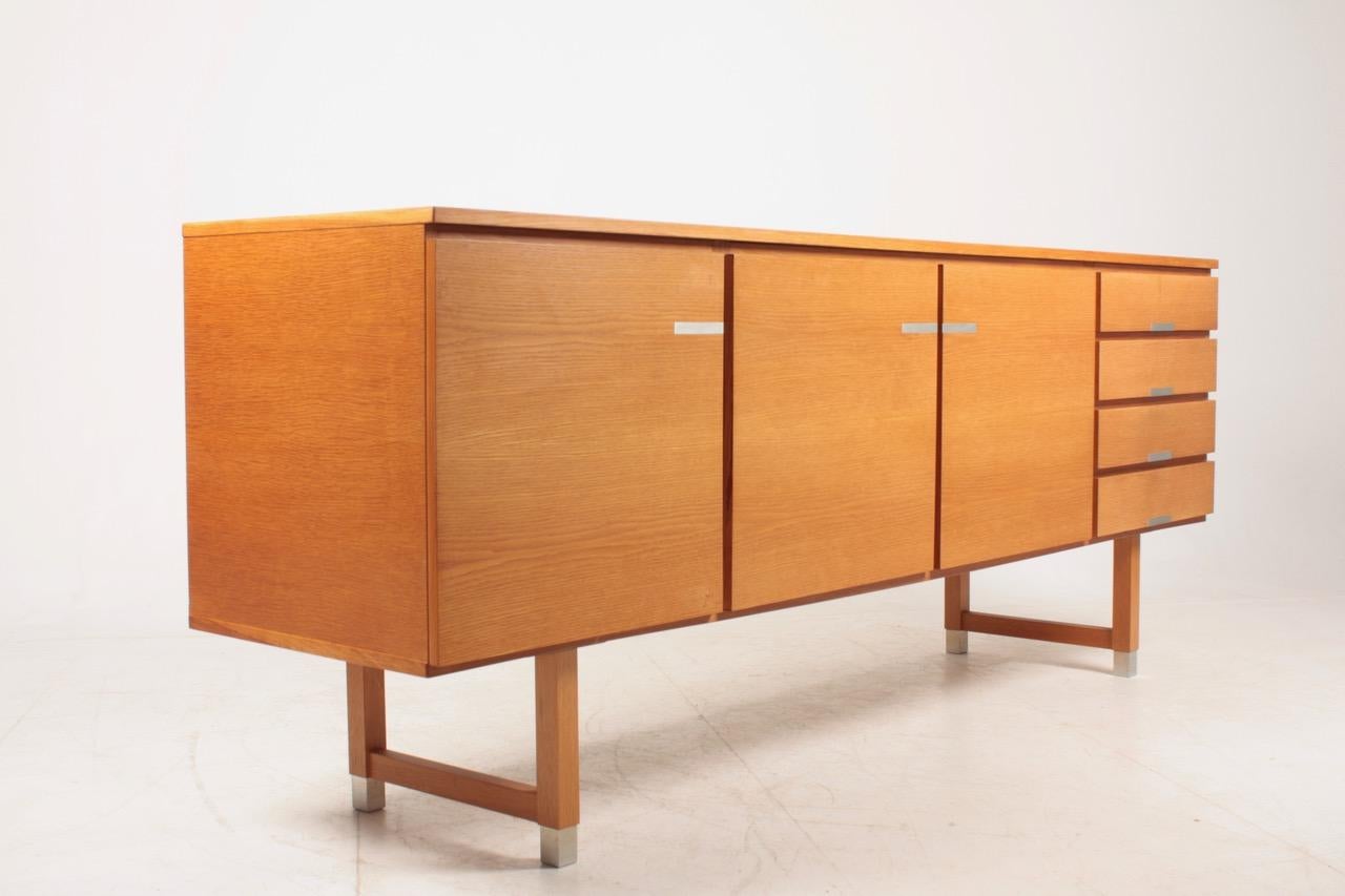 Great looking sideboard in oak, designed and made by Ejgil Petersen, Denmark in 1960s. Very nice original condition.