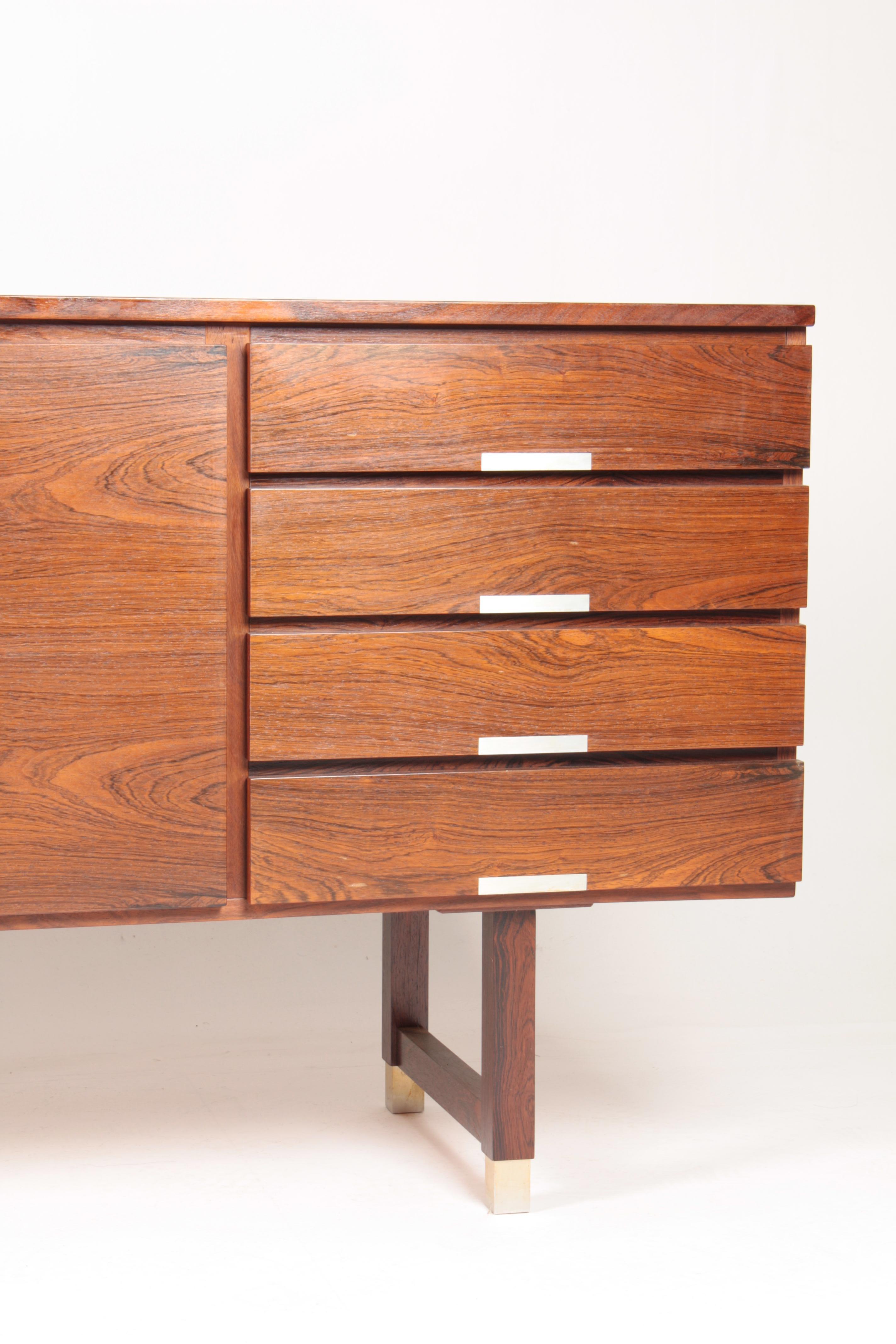 Great looking sideboard in rosewood, designed and made by Ejgil Petersen, Denmark in 1950s. Very nice original condition.