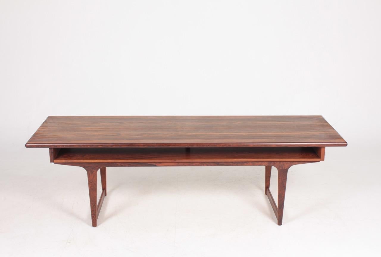 Low table in rosewood designed and made in Denmark, 1960s. Great condition.