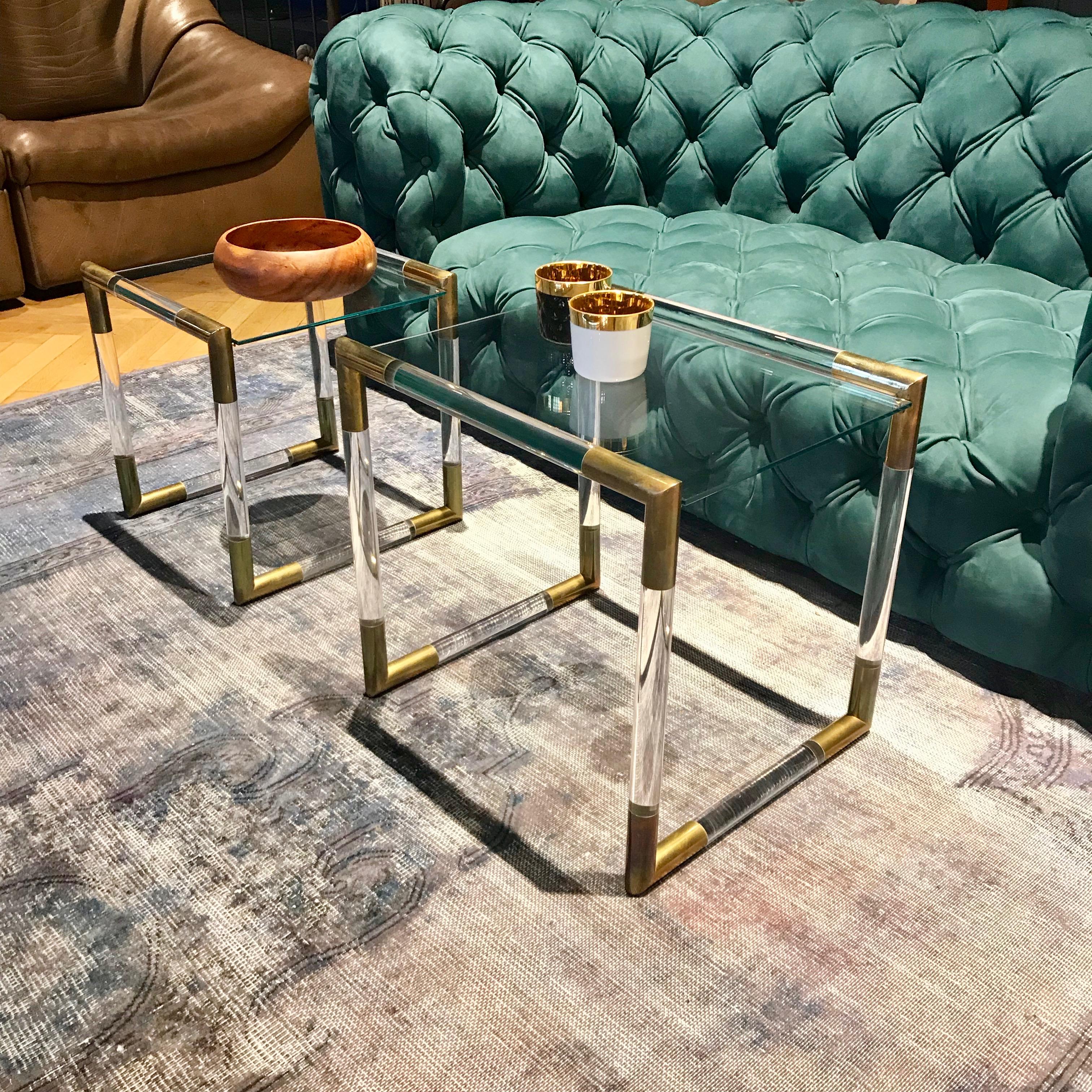 Beautiful nesting or side tables in tubular Lucite with solid brass corners made by Charles Hollis Jones. The tubes are made out of 1 1/4