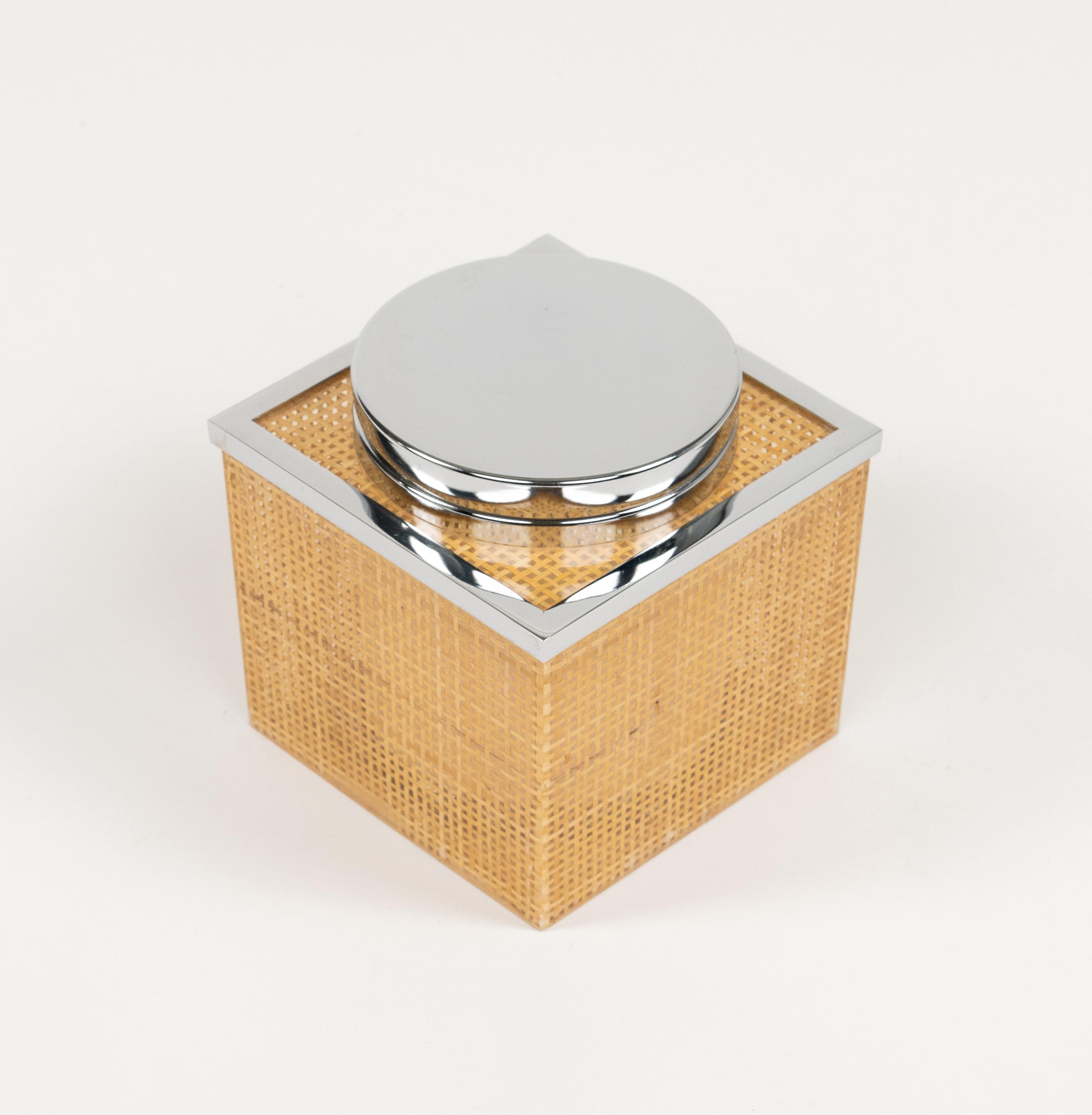 Midcentury wonderful ice bucket in lucite, wicker and chrome in the style of Christian Dior Home.  

Made in Italy in the 1970s.   

Great accessory for any modern interior.